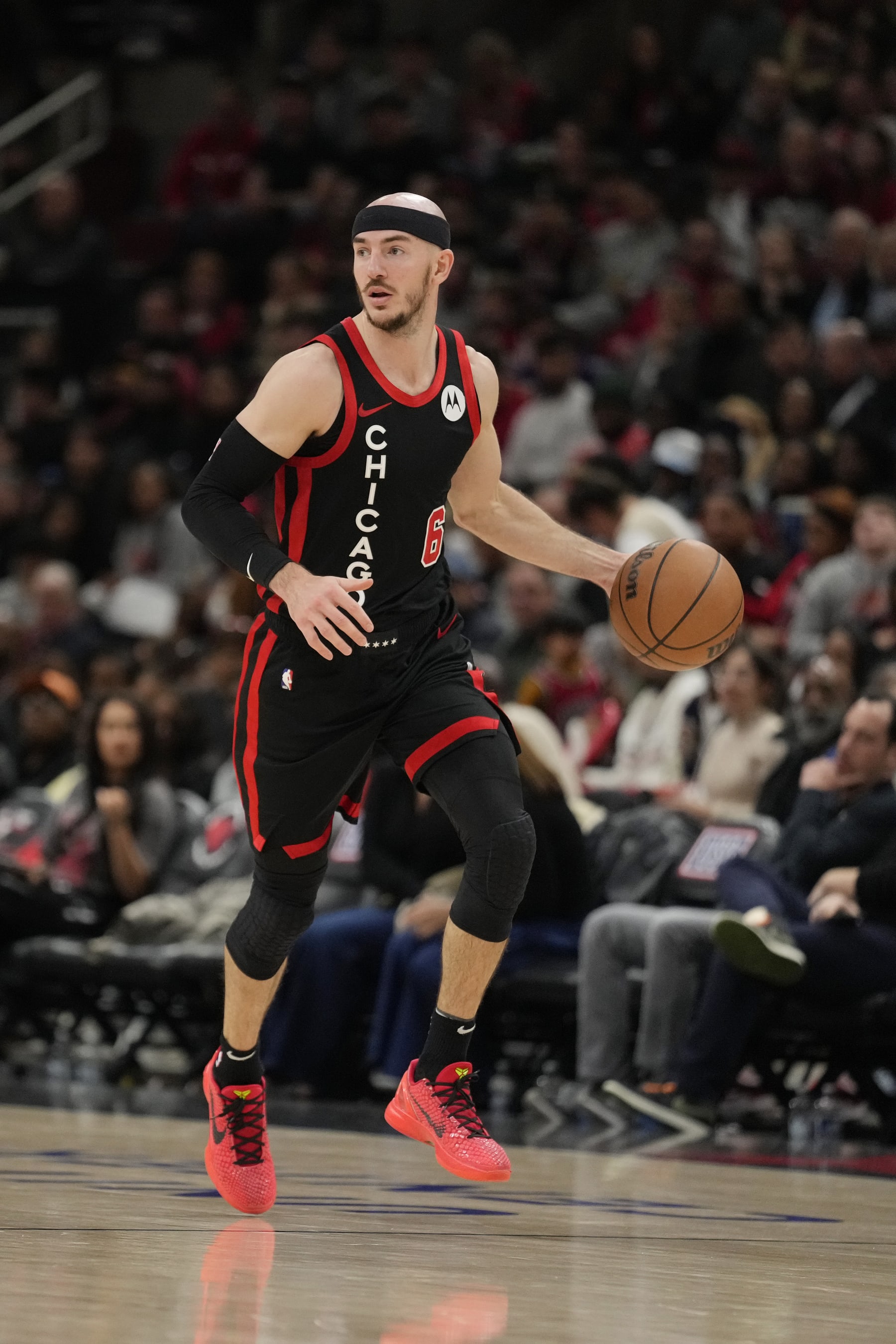 CHICAGO, ILLINOIS - APRIL 01: Alex Caruso #6 of the Chicago Bulls dribbles the ball during the second half against the Atlanta Hawks at the United Center on April 01, 2024 in Chicago, Illinois. NOTE TO USER: User expressly acknowledges and agrees that, by downloading and or using this photograph, User is consenting to the terms and conditions of the Getty Images License Agreement. (Photo by Patrick McDermott/Getty Images)