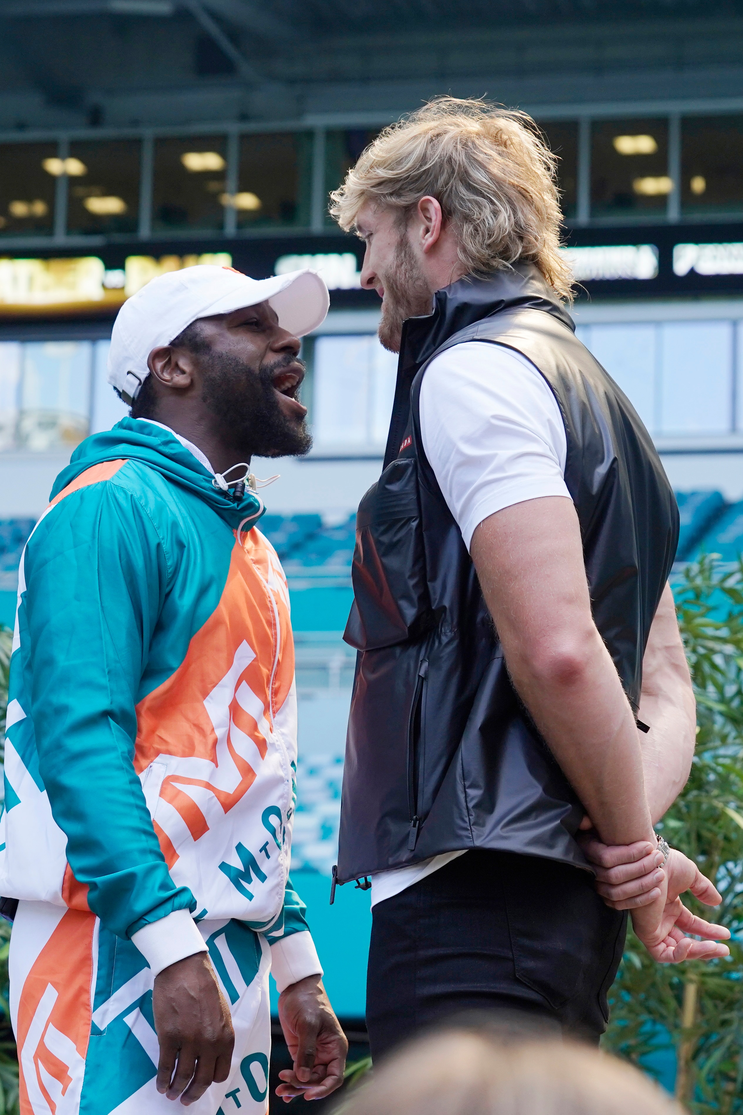 Boxers Floyd Mayweather and Logan Paul taunt each other during a news conference Thursday, May 6, 2021, in Miami Gardens, Fla. Mayweather and Paul are scheduled to face off in an exhibition bout June 6. (AP Photo/Marta Lavandier)
