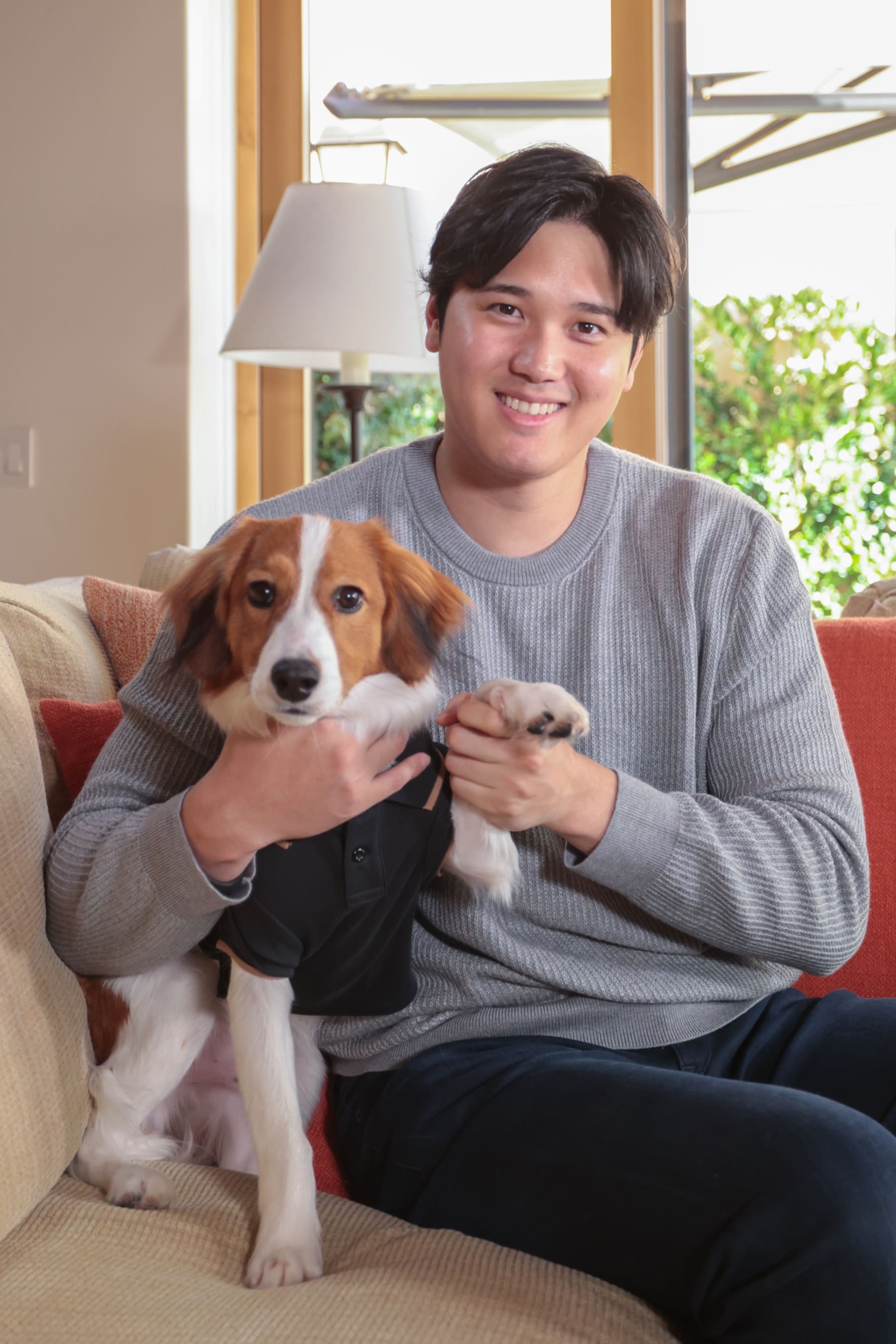 NEWPORT BEACH, CA - NOVEMBER 16 - Shohei Ohtani poses for a photo with his dog prior to the announcement Ohtani winning the 2023 American League Most Valuable Player Award on November 16, 2023 in Newport Beach, California. (Photo by Emma Sharon/MLB Photos via Getty Images