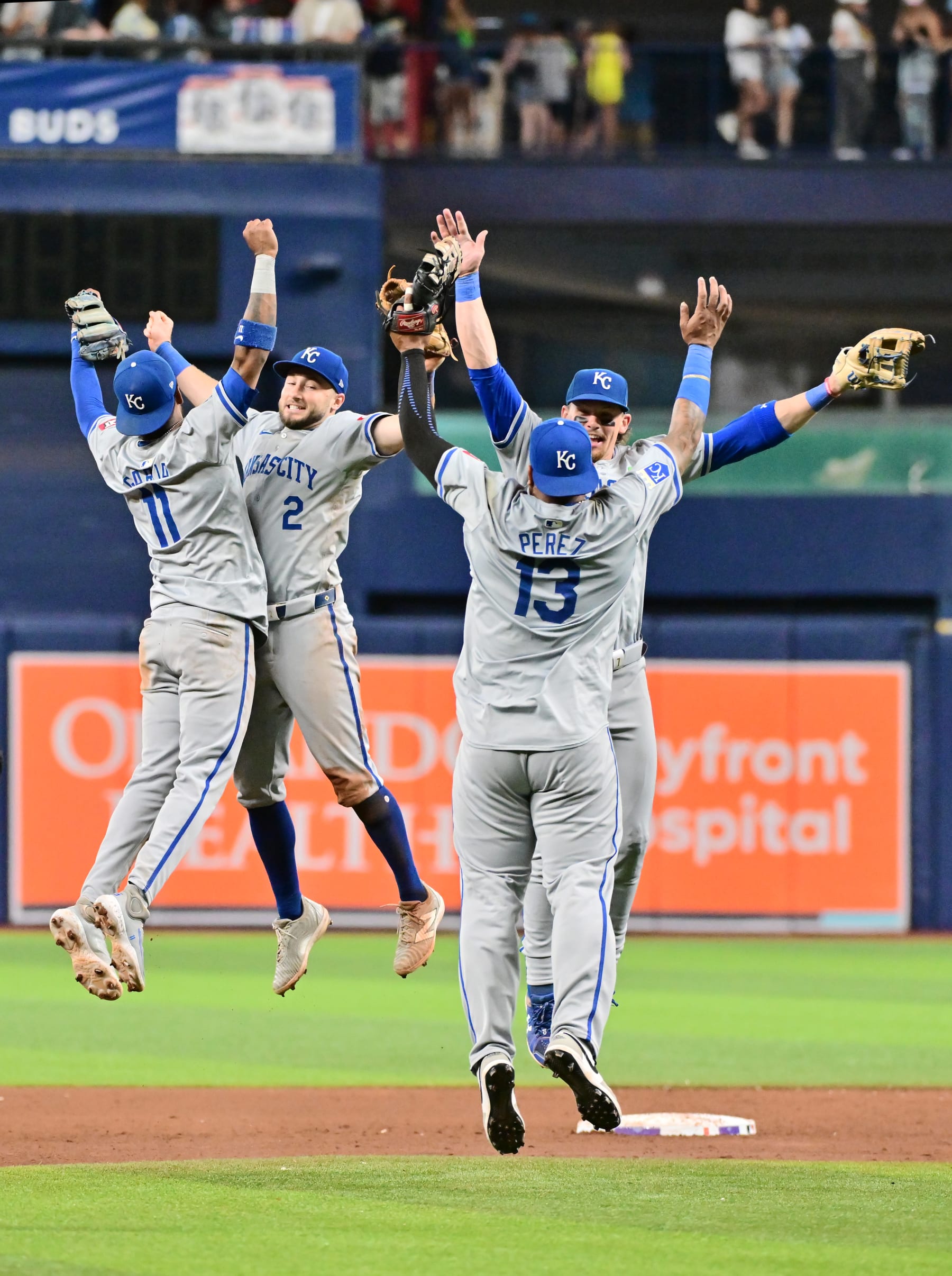 ST PETERSBURG, FLORIDA - MAY 24: (L-R) Maikel Garcia #11, Garrett Hampson #2, Salvador Perez #13 and Bobby Witt Jr. #7 of the Kansas City Royals celebrate after defeating the Tampa Bay Rays 8-1 at Tropicana Field on May 24, 2024 in St Petersburg, Florida. (Photo by Julio Aguilar/Getty Images)