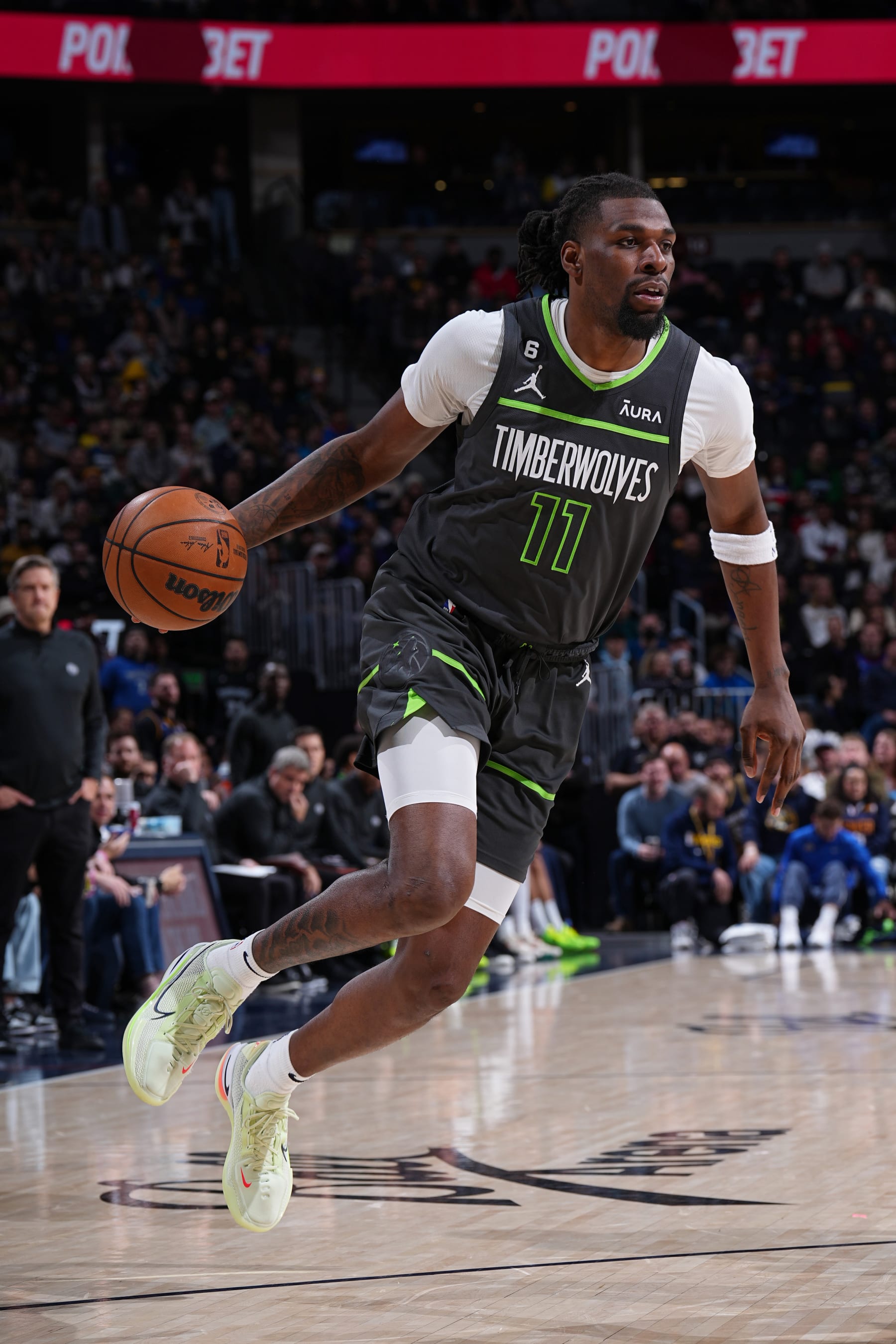 DENVER, CO - JANUARY 18: Naz Reid #11 of the Minnesota Timberwolves dribbles the ball during the game against the Denver Nuggets on January 18, 2023 at the Ball Arena in Denver, Colorado. NOTE TO USER: User expressly acknowledges and agrees that, by downloading and/or using this Photograph, user is consenting to the terms and conditions of the Getty Images License Agreement. Mandatory Copyright Notice: Copyright 2023 NBAE (Photo by Garrett Ellwood/NBAE via Getty Images)