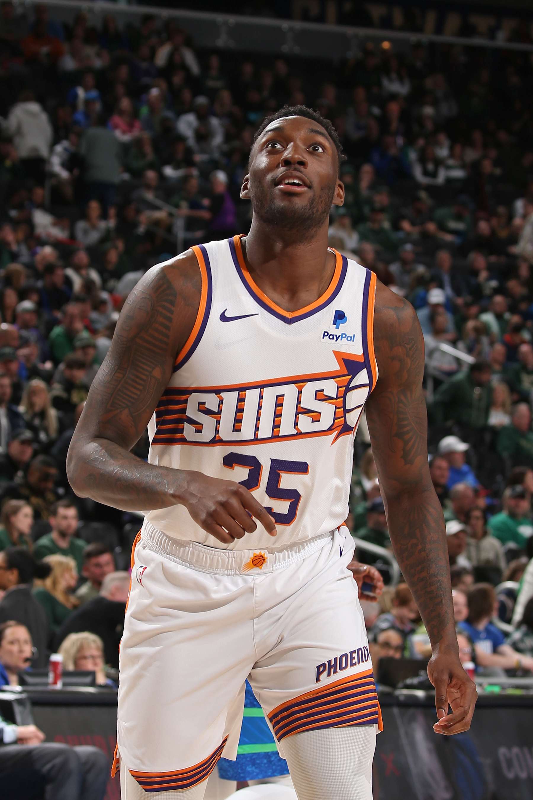 MILWAUKEE, WI - MARCH 17: Nassir Little #25 of the Phoenix Suns looks on during the game against the Milwaukee Bucks on March 17, 2024 at the Fiserv Forum Center in Milwaukee, Wisconsin. NOTE TO USER: User expressly acknowledges and agrees that, by downloading and or using this Photograph, user is consenting to the terms and conditions of the Getty Images License Agreement. Mandatory Copyright Notice: Copyright 2024 NBAE (Photo by Gary Dineen/NBAE via Getty Images).