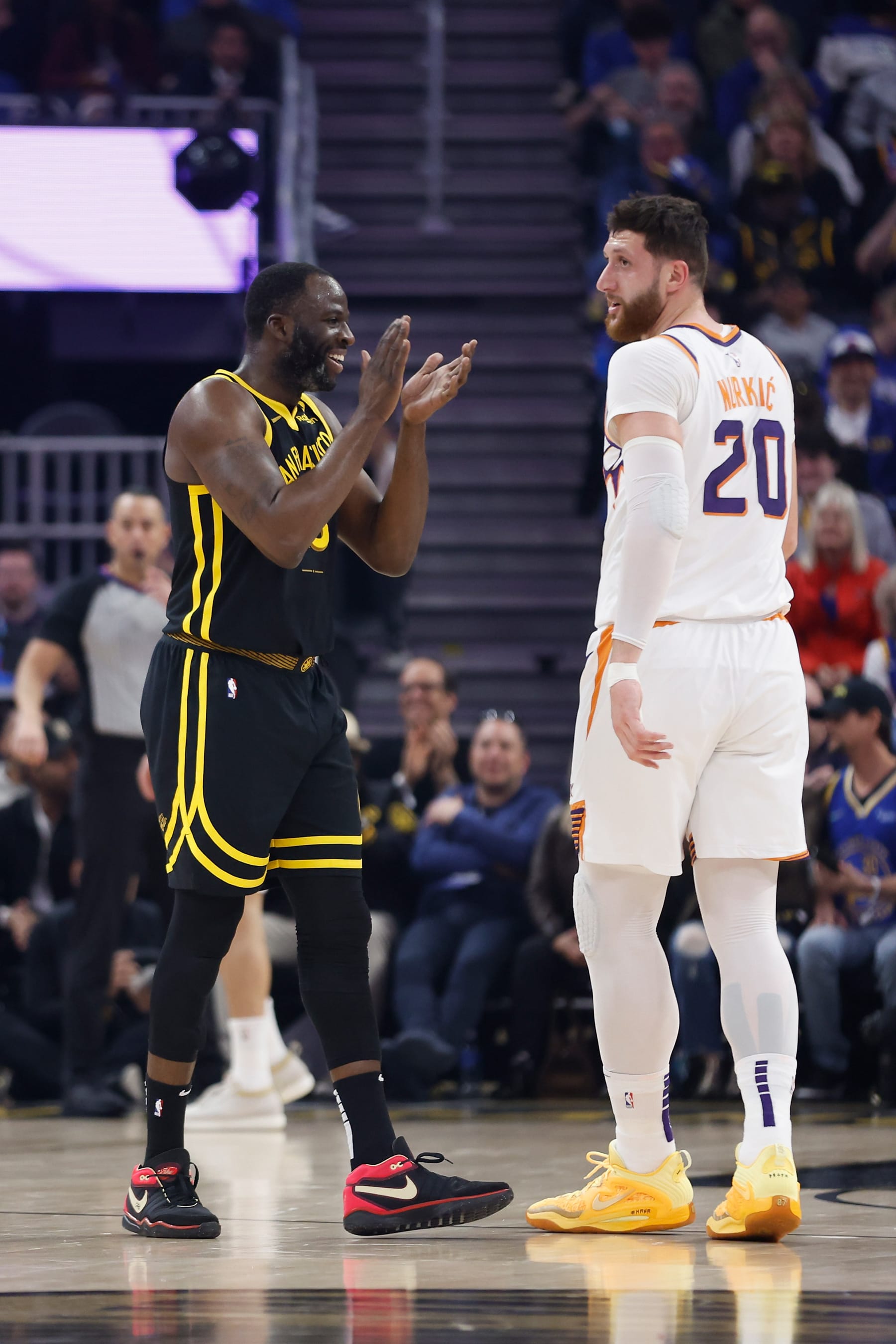SAN FRANCISCO, CALIFORNIA - FEBRUARY 10: Draymond Green #23 of the Golden State Warriors reacts after being fouled by Jusuf Nurkic #20 of the Phoenix Suns in the first quarter at Chase Center on February 10, 2024 in San Francisco, California. NOTE TO USER: User expressly acknowledges and agrees that, by downloading and or using this photograph, User is consenting to the terms and conditions of the Getty Images License Agreement. (Photo by Lachlan Cunningham/Getty Images)