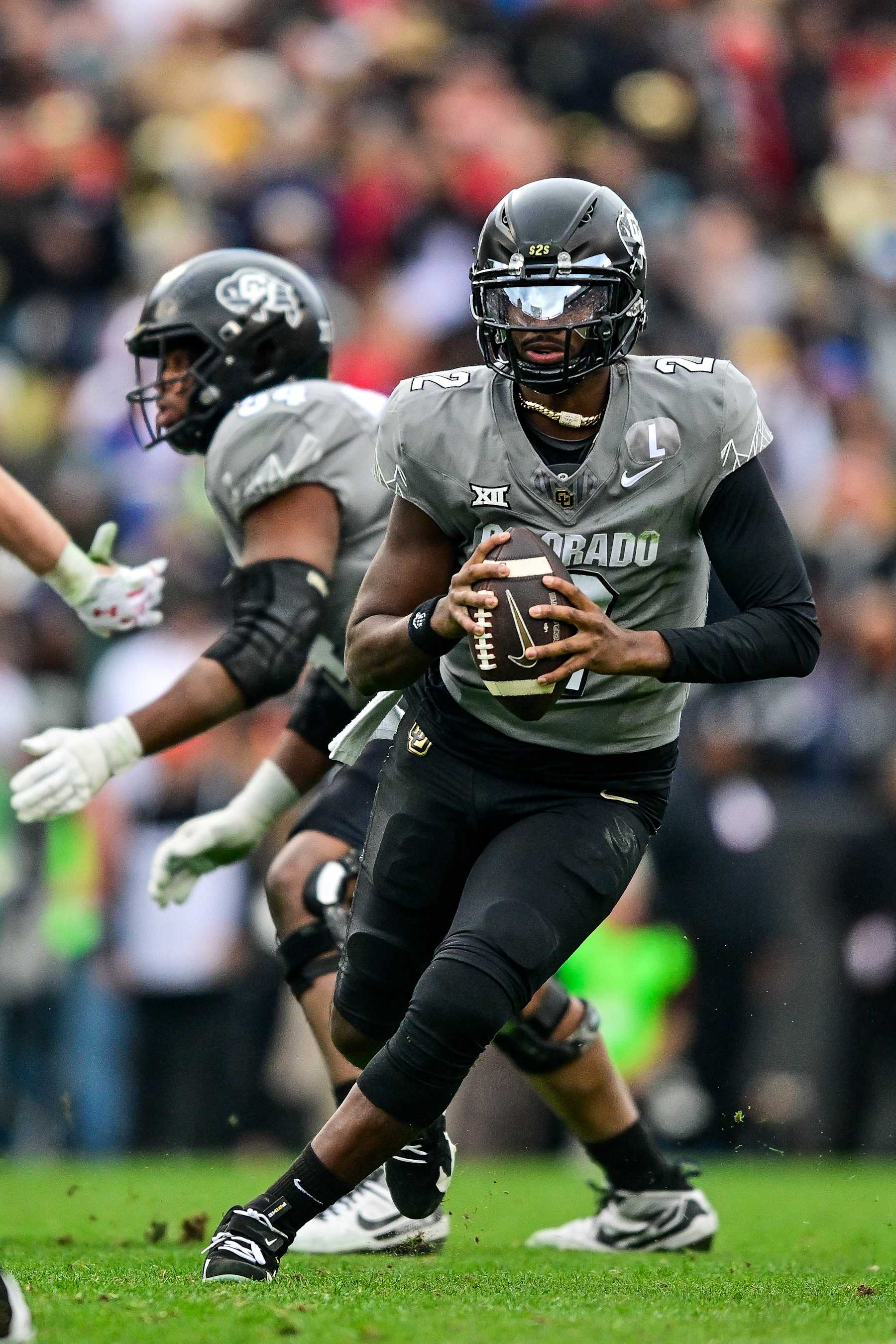 BOULDER, CO - NOVEMBER 16:  Shedeur Sanders #2 of the Colorado Buffaloes looks for a target in the fourth quarter against the Utah Utes at Folsom Field on November 16, 2024 in Boulder, Colorado. (Photo by Dustin Bradford/Getty Images)