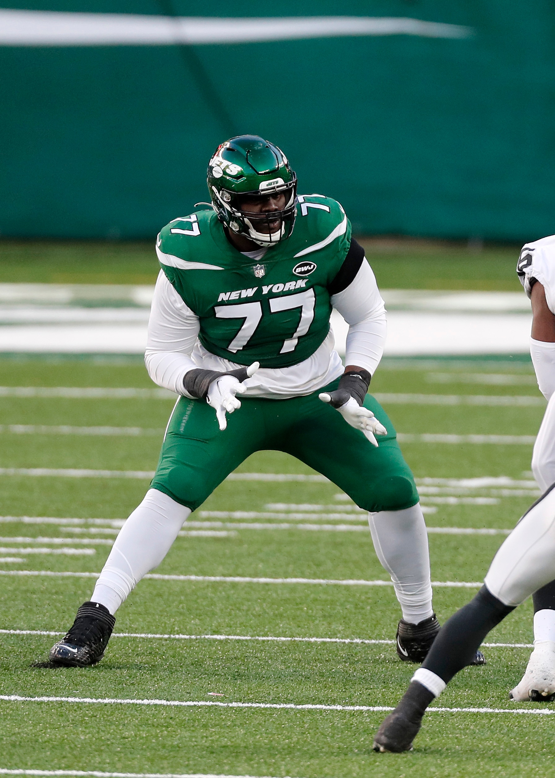 EAST RUTHERFORD, NEW JERSEY - DECEMBER 06: (NEW YORK DAILIES OUT)  Mekhi Becton #77 of the New York Jets in action against the Las Vegas Raiders at MetLife Stadium on December 06, 2020 in East Rutherford, New Jersey. The Raiders defeated the Jets 31-28. (Photo by Jim McIsaac/Getty Images)