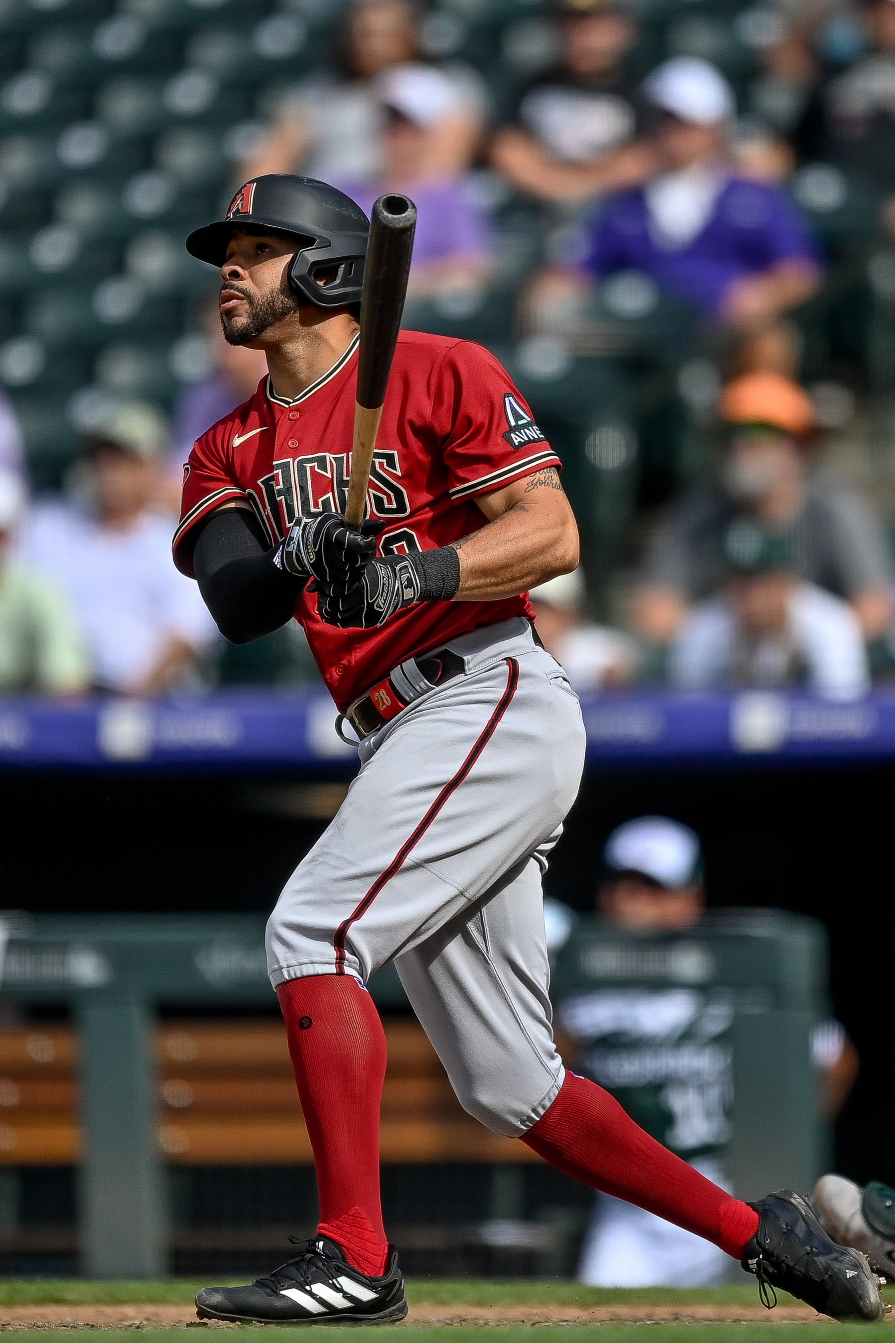 DENVER, CO - AUGUST 16: Tommy Pham #28 of the Arizona Diamondbacks hits a ninth inning RBI sacrifice fly against the Colorado Rockies at Coors Field on August 16, 2023 in Denver, Colorado. (Photo by Dustin Bradford/Getty Images)