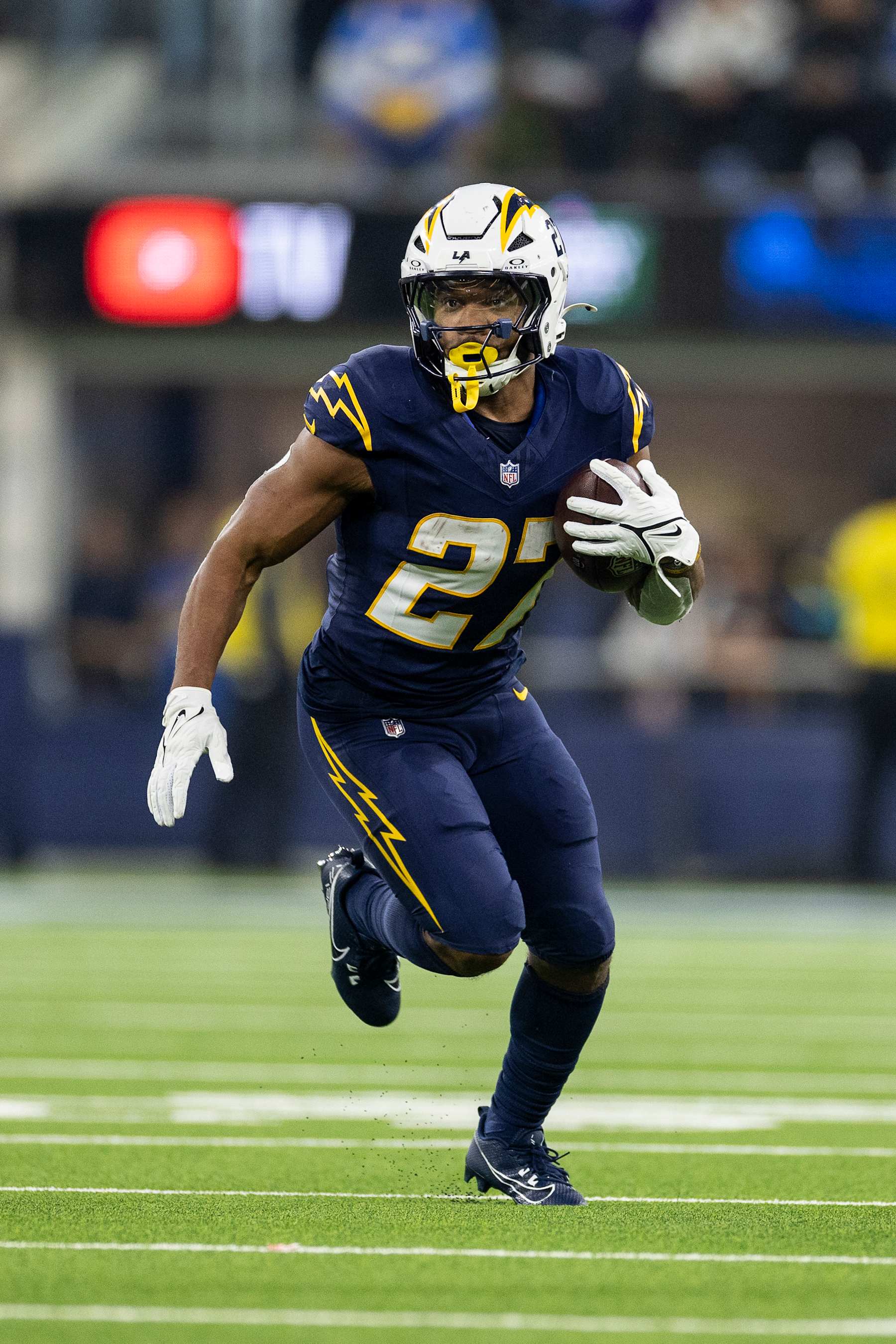 INGLEWOOD, CALIFORINA - NOVEMBER 25: J.K. Dobbins #27 of the Los Angeles Chargers runs with the ball during an NFL Football game against the Baltimore Ravens at SoFi Stadium on November 25, 2024 in Inglewood, Califorina. (Photo by Michael Owens/Getty Images)