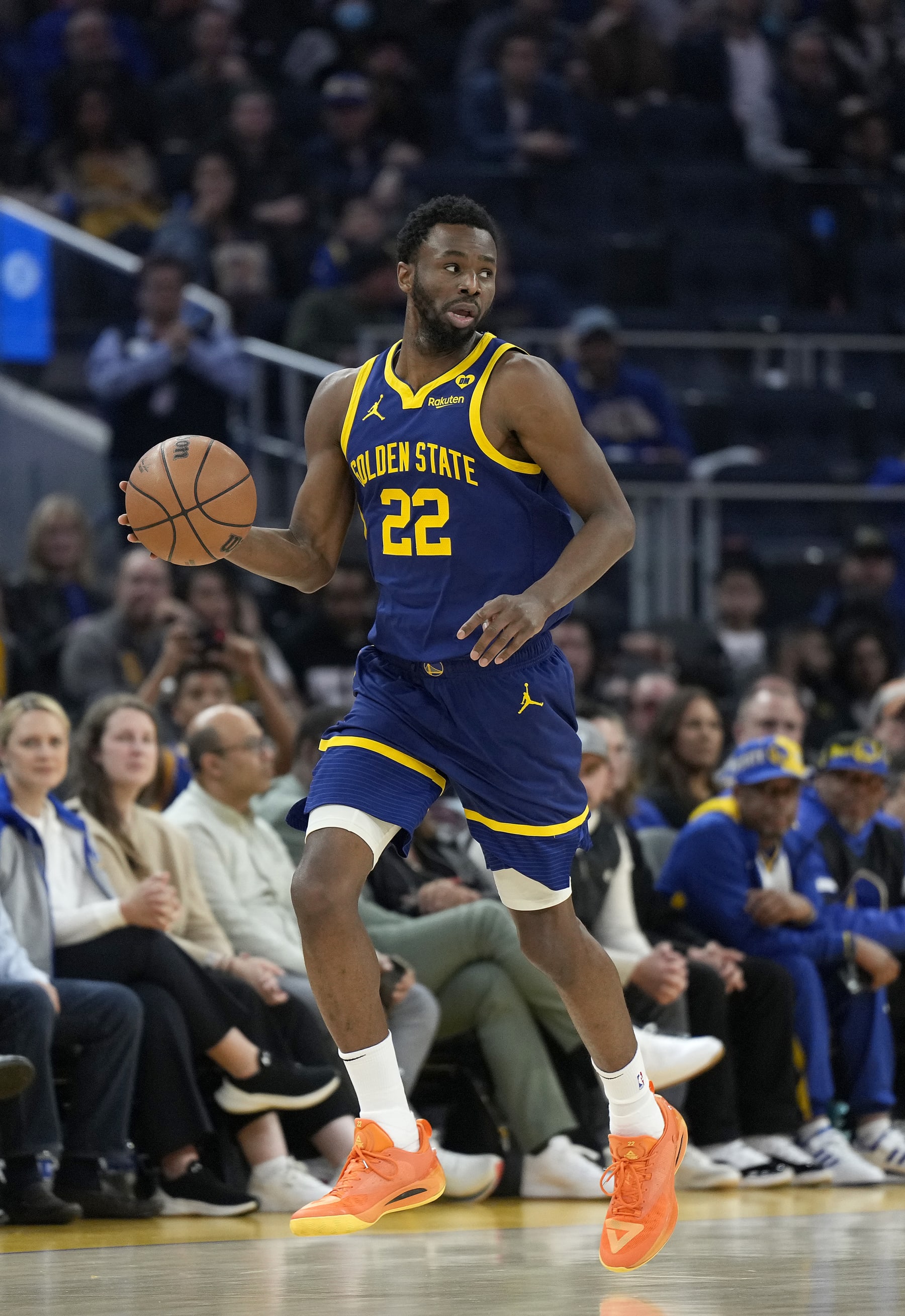 SAN FRANCISCO, CALIFORNIA - FEBRUARY 23: Andrew Wiggins #22 of the Golden State Warriors dribbles the ball up court against the Charlotte Hornets during the first quarter of an NBA basketball game at Chase Center on February 23, 2024 in San Francisco, California. NOTE TO USER: User expressly acknowledges and agrees that, by downloading and or using this photograph, User is consenting to the terms and conditions of the Getty Images License Agreement. (Photo by Thearon W. Henderson/Getty Images)