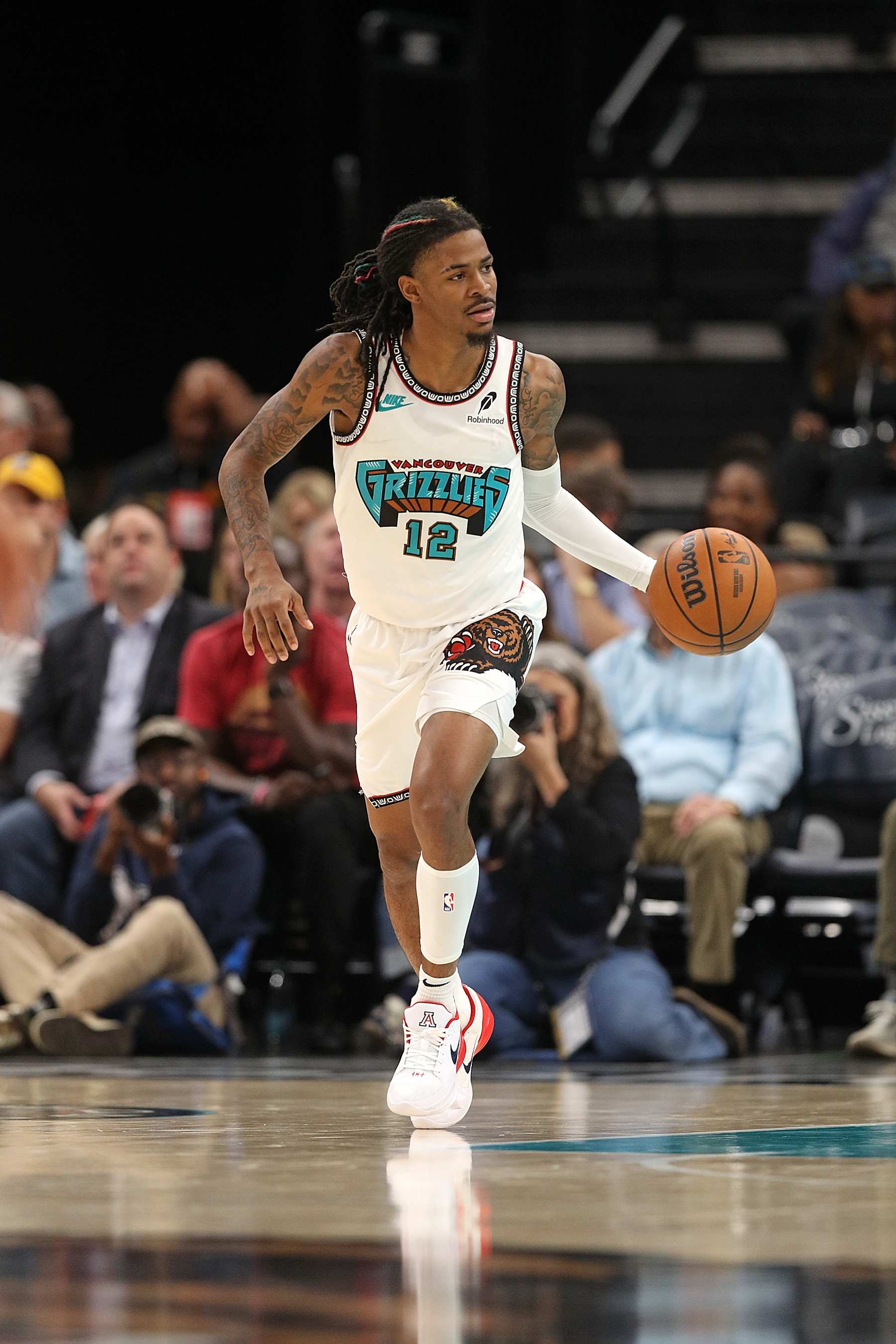 MEMPHIS, TENNESSEE - NOVEMBER 06: Ja Morant #12 of the Memphis Grizzlies brings the ball up court during the game against the Los Angeles Lakers at FedExForum on November 06, 2024 in Memphis, Tennessee. NOTE TO USER: User expressly acknowledges and agrees that, by downloading and or using this photograph, User is consenting to the terms and conditions of the Getty Images License Agreement. (Photo by Justin Ford/Getty Images)
