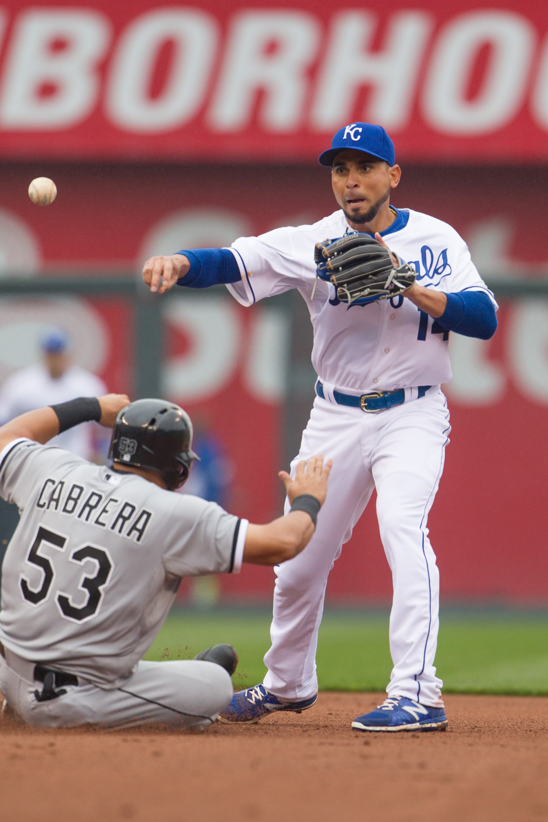 April 6, 2014: Kansas City Royals second baseman Omar Infante (14) throws to first over Chicago White Sox left fielder Melky Cabrera (53) during the MLB American League opening day game between the Chicago White Sox and the Kansas City Royals at Kauffman Stadium in Kansas City, Kansas (Photo by William Purnell/Icon Sportswire/Corbis/Icon Sportswire via Getty Images)