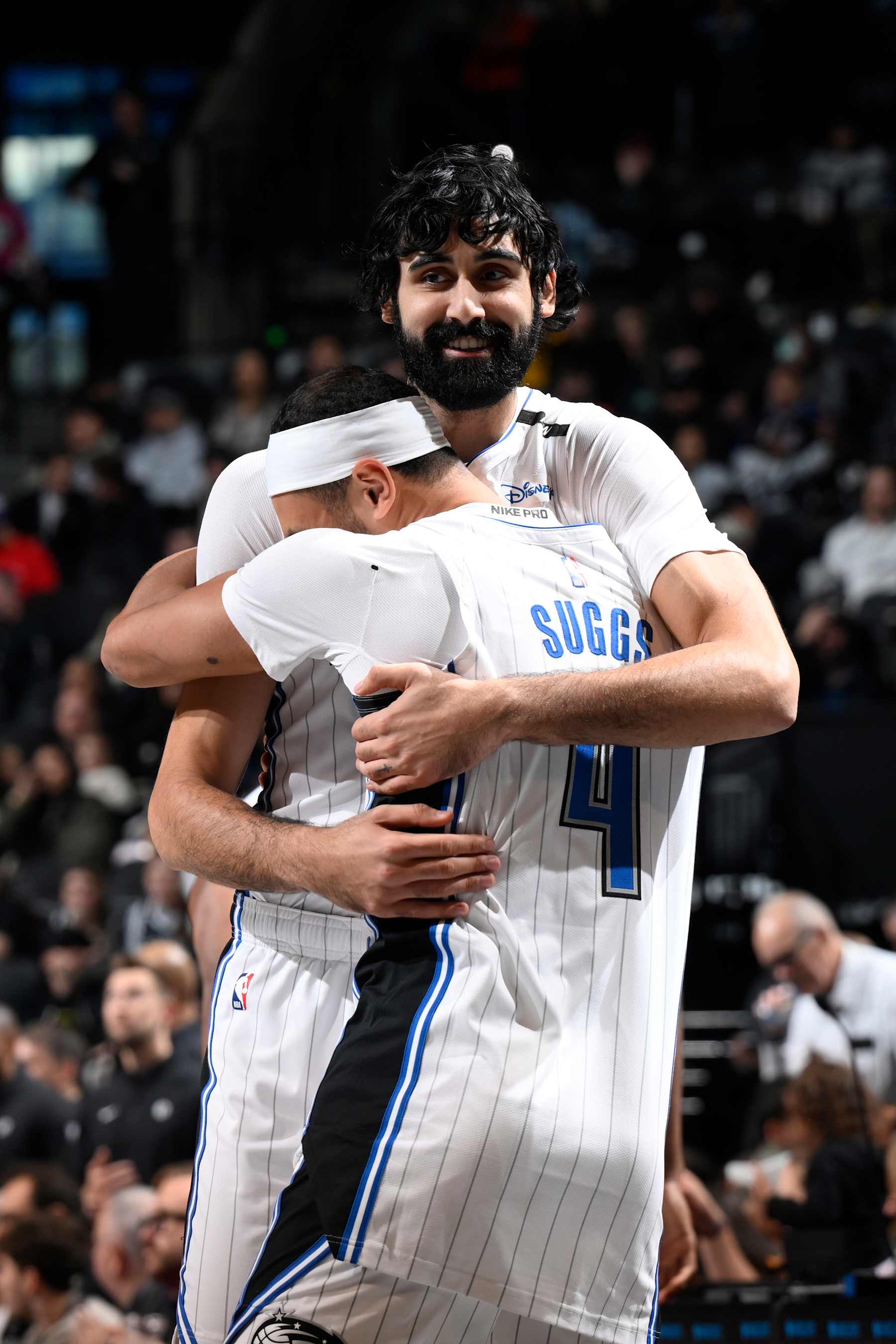 BROOKLYN, NY - DECEMBER 1: Goga Bitadze #35 and Jalen Suggs #4 of the Orlando Magic hug before the game against the Brooklyn Nets on December 1, 2024 at Barclays Center in Brooklyn, New York. NOTE TO USER: User expressly acknowledges and agrees that, by downloading and or using this Photograph, user is consenting to the terms and conditions of the Getty Images License Agreement. Mandatory Copyright Notice: Copyright 2024 NBAE (Photo by David Dow/NBAE via Getty Images)