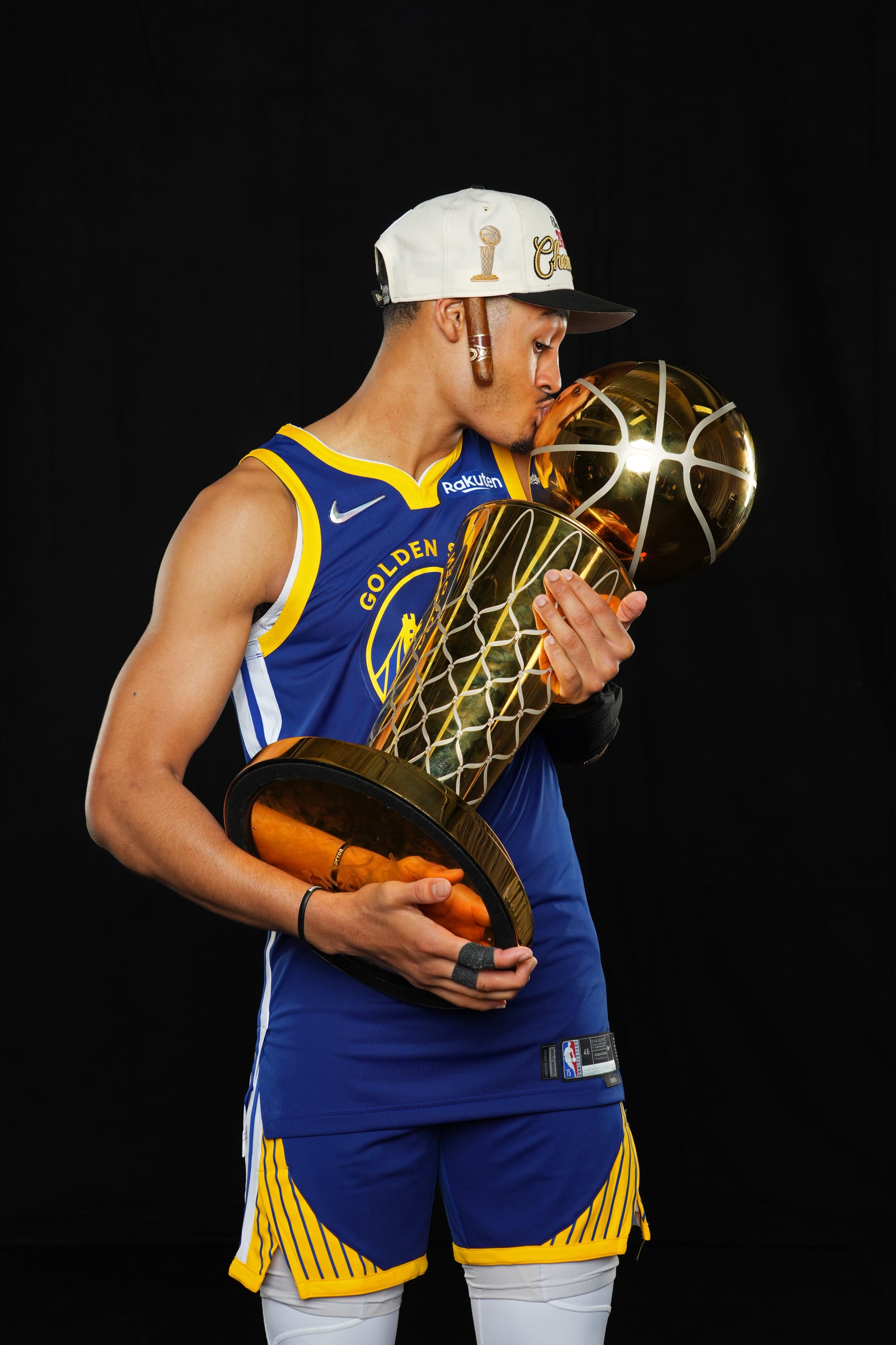 BOSTON, MA - JUNE 16: Jordan Poole #3 of the Golden State Warriors poses for a portrait with the Larry OBrien Trophy after winning Game Six of the 2022 NBA Finals against the Boston Celtics on June 16, 2022 at TD Garden in Boston, Massachusetts. NOTE TO USER: User expressly acknowledges and agrees that, by downloading and or using this photograph, user is consenting to the terms and conditions of Getty Images License Agreement. Mandatory Copyright Notice: Copyright 2022 NBAE (Photo by Jesse D. Garrabrant/NBAE via Getty Images)