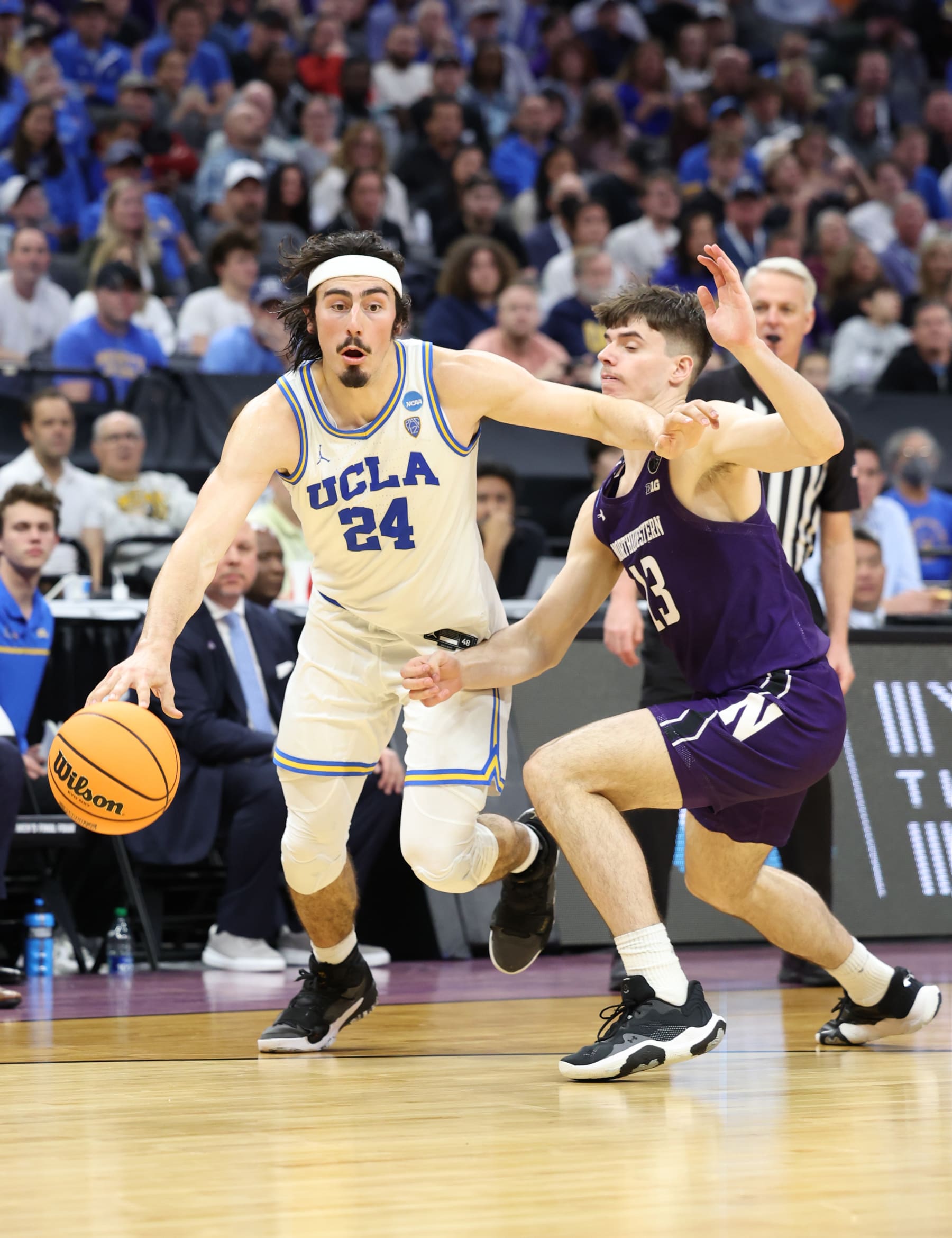 SACRAMENTO, CALIFORNIA - MARCH 18: Jaime Jaquez Jr. #24 of the UCLA Bruins drives to the basket during the second half against the Brooks Barnhizer #13 of the Northwestern Wildcats in the second round of the NCAA Men's Basketball Tournament at Golden 1 Center on March 18, 2023 in Sacramento, California. (Photo by Ezra Shaw/Getty Images)