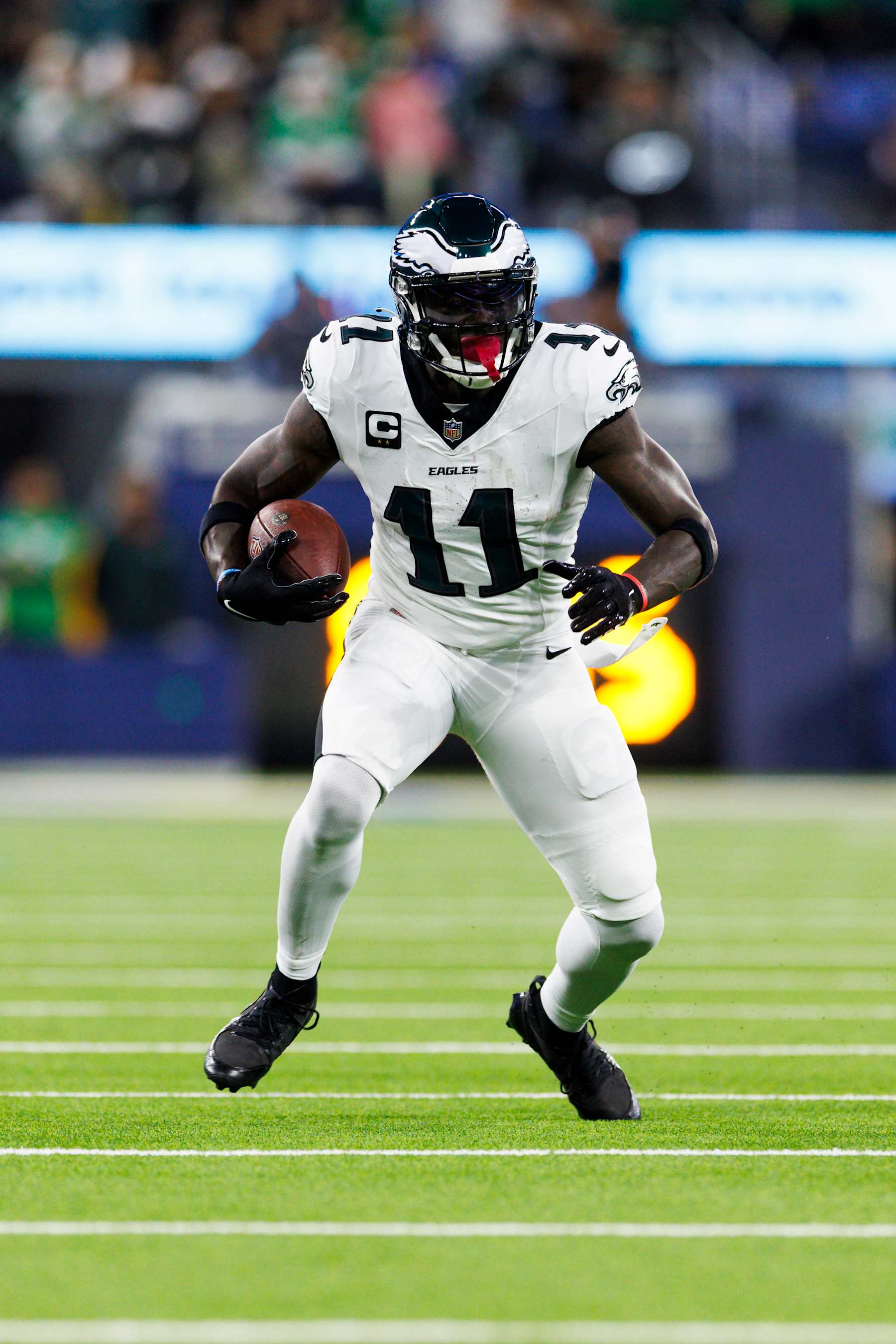 INGLEWOOD, CALIFORNIA - NOVEMBER 24: A.J. Brown #11 of the Philadelphia Eagles runs after the catch during the first half against the Los Angeles Rams at SoFi Stadium on November 24, 2024 in Inglewood, California. (Photo by Ric Tapia/Getty Images)