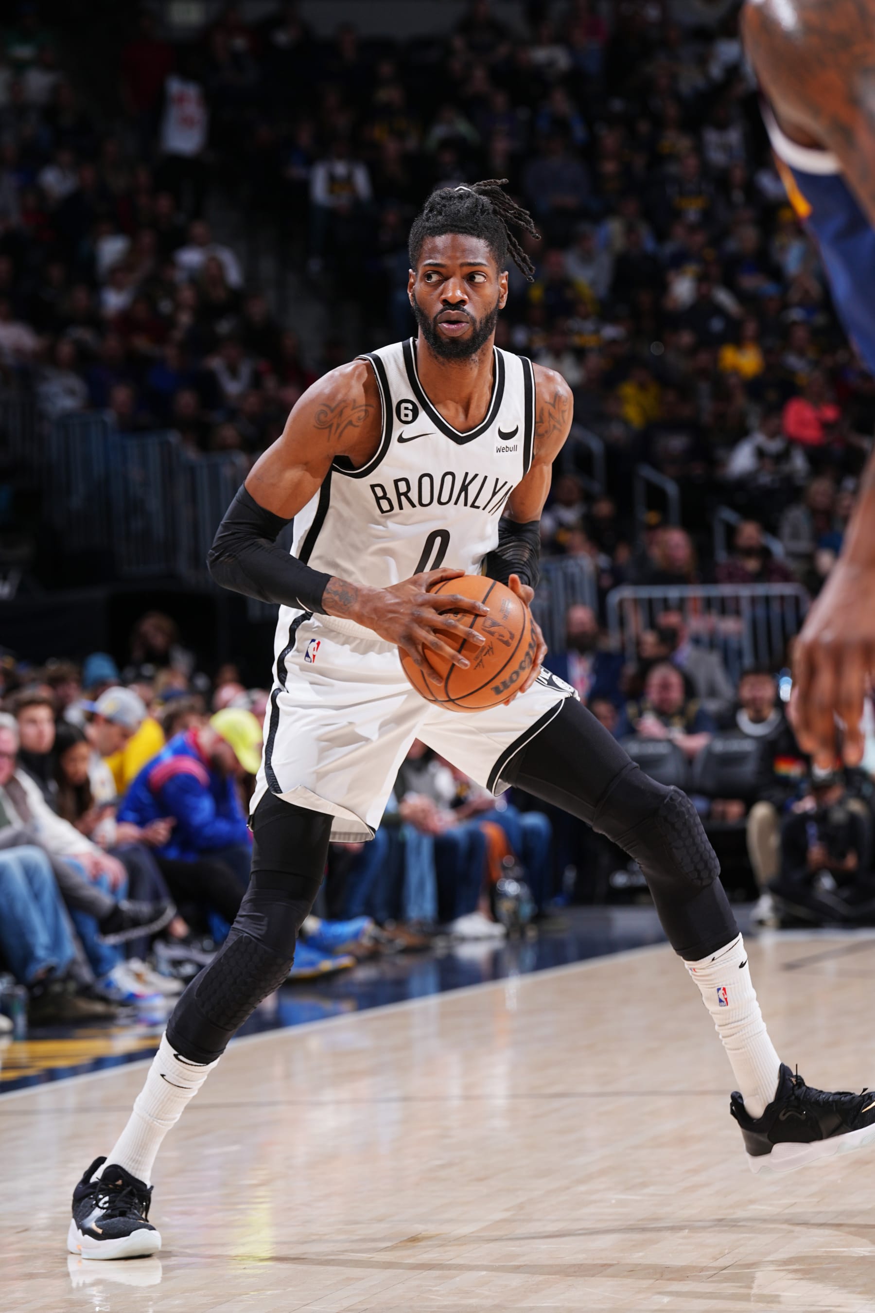 DENVER, CO - MARCH 12: Nerlens Noel #0 of the Brooklyn Nets looks to pass the ball during the game against the Denver Nuggets on March 12, 2023 at the Ball Arena in Denver, Colorado. NOTE TO USER: User expressly acknowledges and agrees that, by downloading and/or using this Photograph, user is consenting to the terms and conditions of the Getty Images License Agreement. Mandatory Copyright Notice: Copyright 2023 NBAE (Photo by Bart Young/NBAE via Getty Images)
