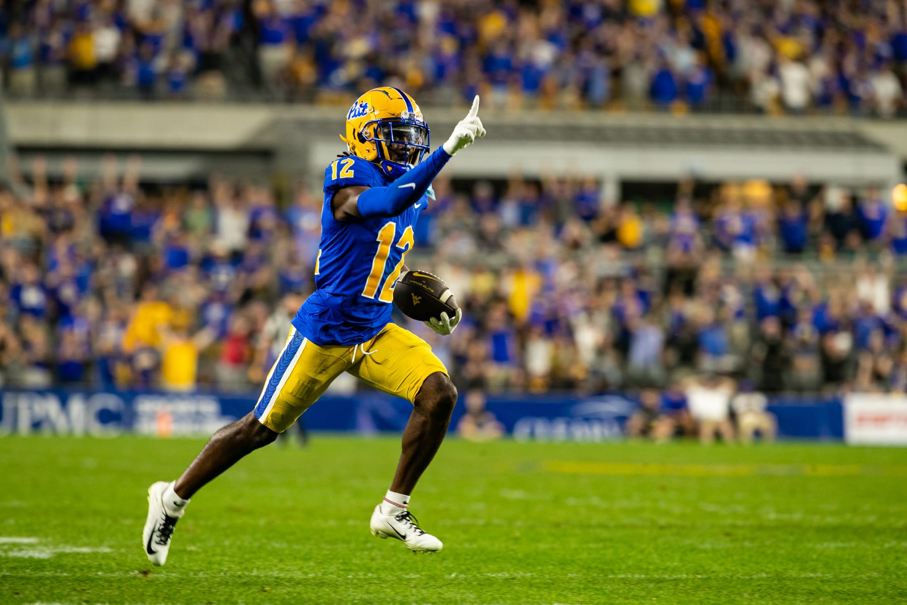 PITTSBURGH, PA - SEPTEMBER 01: Pittsburgh Panthers defensive back M.J. Devonshire (12) intercepts a pass and returns it for a touchdown during the college football game between the West Virginia Mountaineers and the Pittsburgh Panthers on September 01, 2022 at Acrisure Stadium in Pittsburgh, PA. (Photo by Mark Alberti/Icon Sportswire via Getty Images)