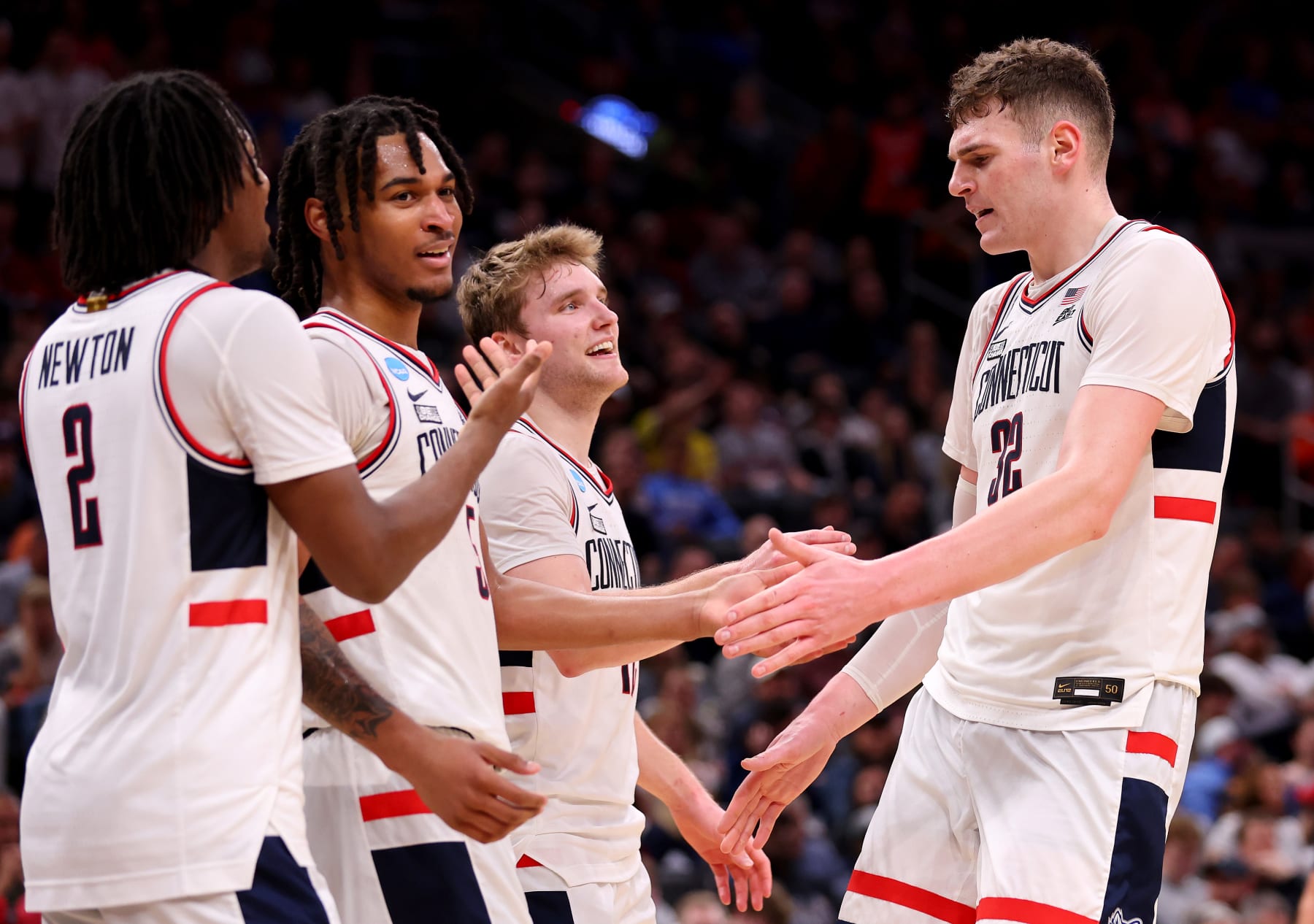 BOSTON, MASSACHUSETTS - MARCH 28: Donovan Clingan #32 of the Connecticut Huskies high fives Stephon Castle #5 against the San Diego State Aztecs during the second half in the Sweet 16 round of the NCAA Men's Basketball Tournament at TD Garden on March 28, 2024 in Boston, Massachusetts. (Photo by Michael Reaves/Getty Images)
