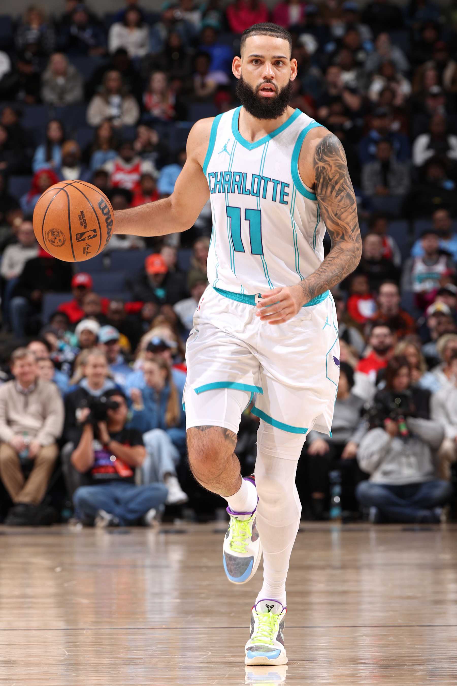 MEMPHIS, TN - JANUARY 22: Cody Martin #11 of the Charlotte Hornets looks on during the game against the Memphis Grizzlies on January 22, 2025 at FedExForum in Memphis, Tennessee. NOTE TO USER: User expressly acknowledges and agrees that, by downloading and or using this photograph, User is consenting to the terms and conditions of the Getty Images License Agreement. Mandatory Copyright Notice: Copyright 2025 NBAE (Photo by Joe Murphy/NBAE via Getty Images)