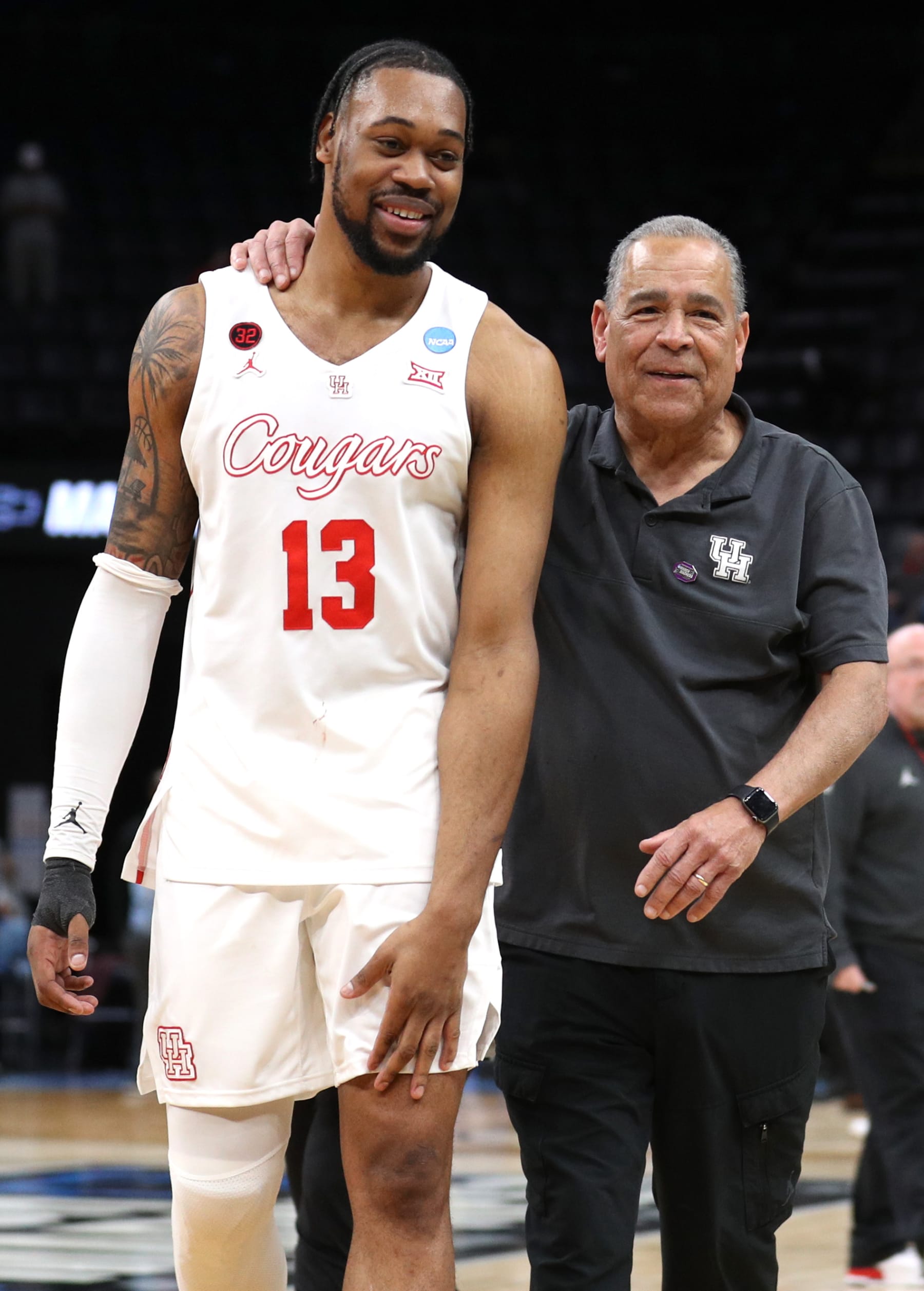 MEMPHIS, TENNESSEE - MARCH 24: J'Wan Roberts #13 and head coach Kelvin Sampson of the Houston Cougars embrace following their team's victory against the Texas A&M Aggies in the second round of the NCAA Men's Basketball Tournament at FedExForum on March 24, 2024 in Memphis, Tennessee. (Photo by Justin Ford/Getty Images)