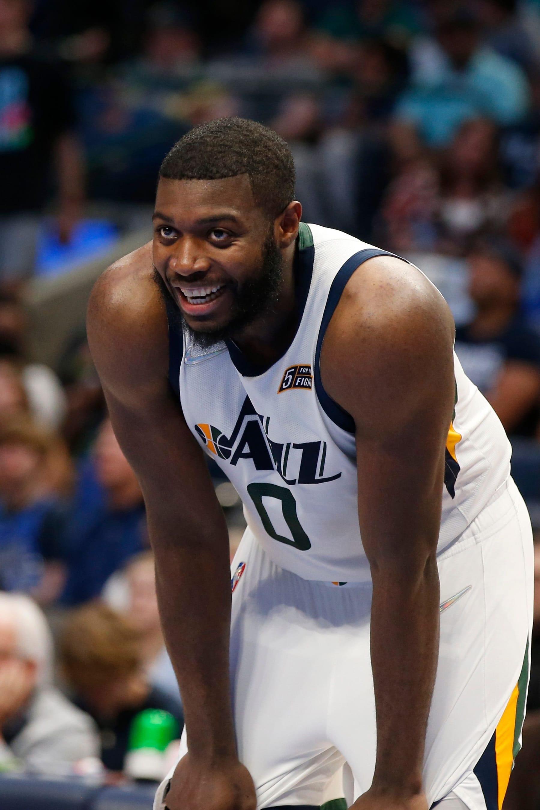 DALLAS, TEXAS - MARCH 27: Eric Paschall #0 of the Utah Jazz smiles on the court in the game against the Dallas Mavericks at American Airlines Center on March 27, 2022 in Dallas, Texas. NOTE TO USER: User expressly acknowledges and agrees that, by downloading and or using this photograph, User is consenting to the terms and conditions of the Getty Images License Agreement.  (Photo by Tim Heitman/Getty Images)