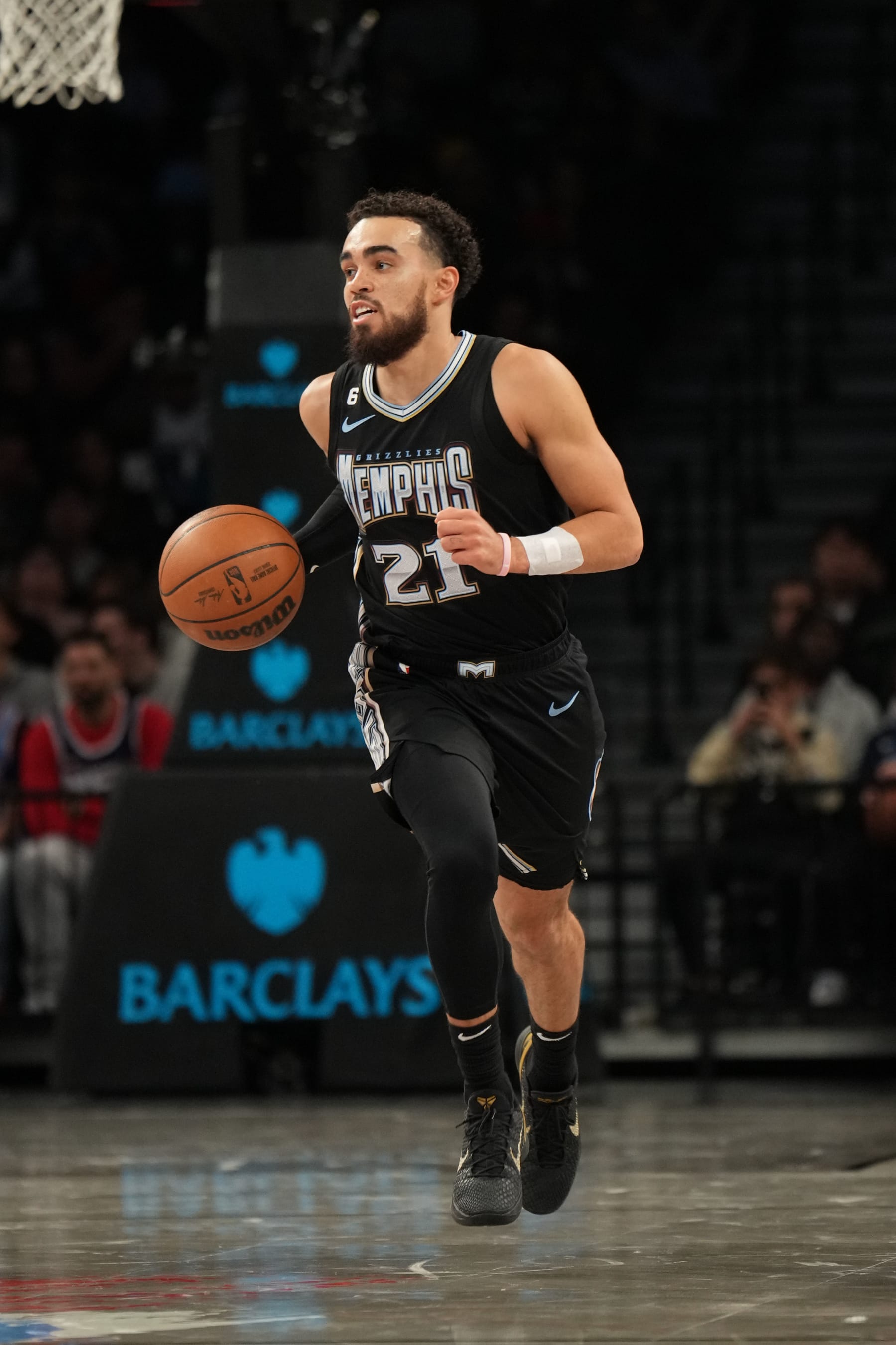 BROOKLYN, NY - NOVEMBER 20: Tyus Jones #21 of the Memphis Grizzlies dribbles the ball during the game against the Brooklyn Nets on November 20, 2022 at Barclays Center in Brooklyn, New York. NOTE TO USER: User expressly acknowledges and agrees that, by downloading and or using this Photograph, user is consenting to the terms and conditions of the Getty Images License Agreement. Mandatory Copyright Notice: Copyright 2022 NBAE (Photo by Jesse D. Garrabrant/NBAE via Getty Images)