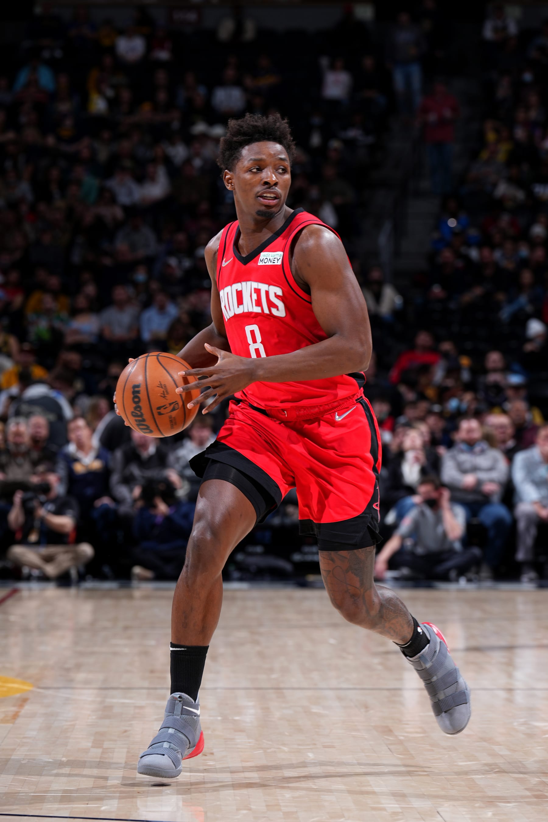 DENVER, CO - MARCH 4: JaeSean Tate #8 of the Houston Rockets dribbles the ball during the game on March 4, 2022 at the Ball Arena in Denver, Colorado. NOTE TO USER: User expressly acknowledges and agrees that, by downloading and/or using this Photograph, user is consenting to the terms and conditions of the Getty Images License Agreement. Mandatory Copyright Notice: Copyright 2022 NBAE (Photo by Garrett Ellwood/NBAE via Getty Images)