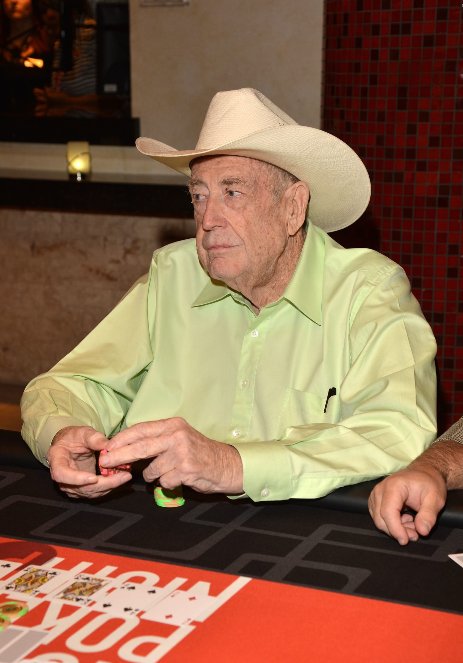 LAS VEGAS, NV - APRIL 27:  Professional poker player Doyle Brunson participates in Tiger's Charity Poker Night during Tiger Jam 2012 at the Mandalay Bay Resort & Casino April 27, 2012 in Las Vegas, Nevada. The event benefits the Tiger Woods Foundation.  (Photo by Lester Cohen/WireImage)