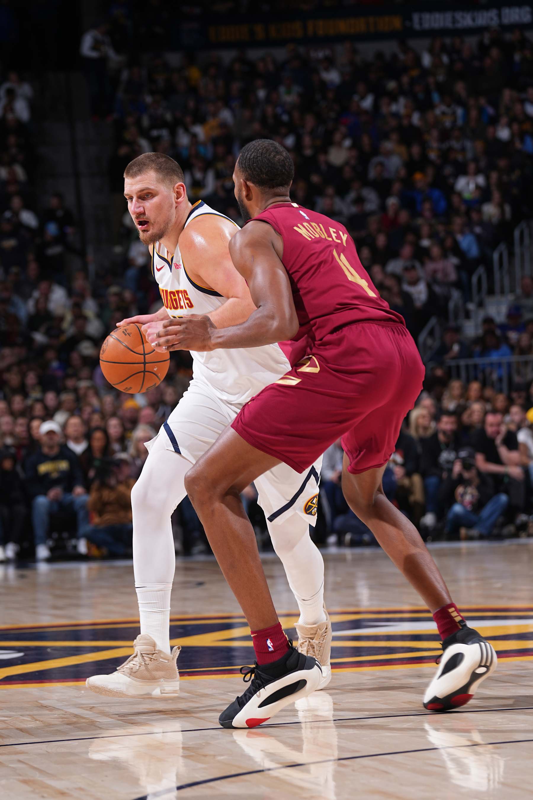 Nikola JokiÄ and Evan Mobley