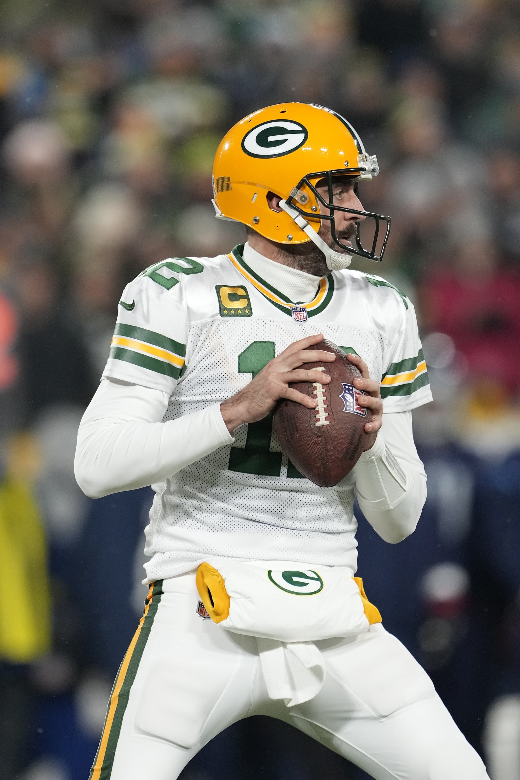 GREEN BAY, WISCONSIN - NOVEMBER 17: Aaron Rodgers #12 of the Green Bay Packers looks to throw a pass against the Tennessee Titans during the second half in the game at Lambeau Field on November 17, 2022 in Green Bay, Wisconsin. (Photo by Patrick McDermott/Getty Images)