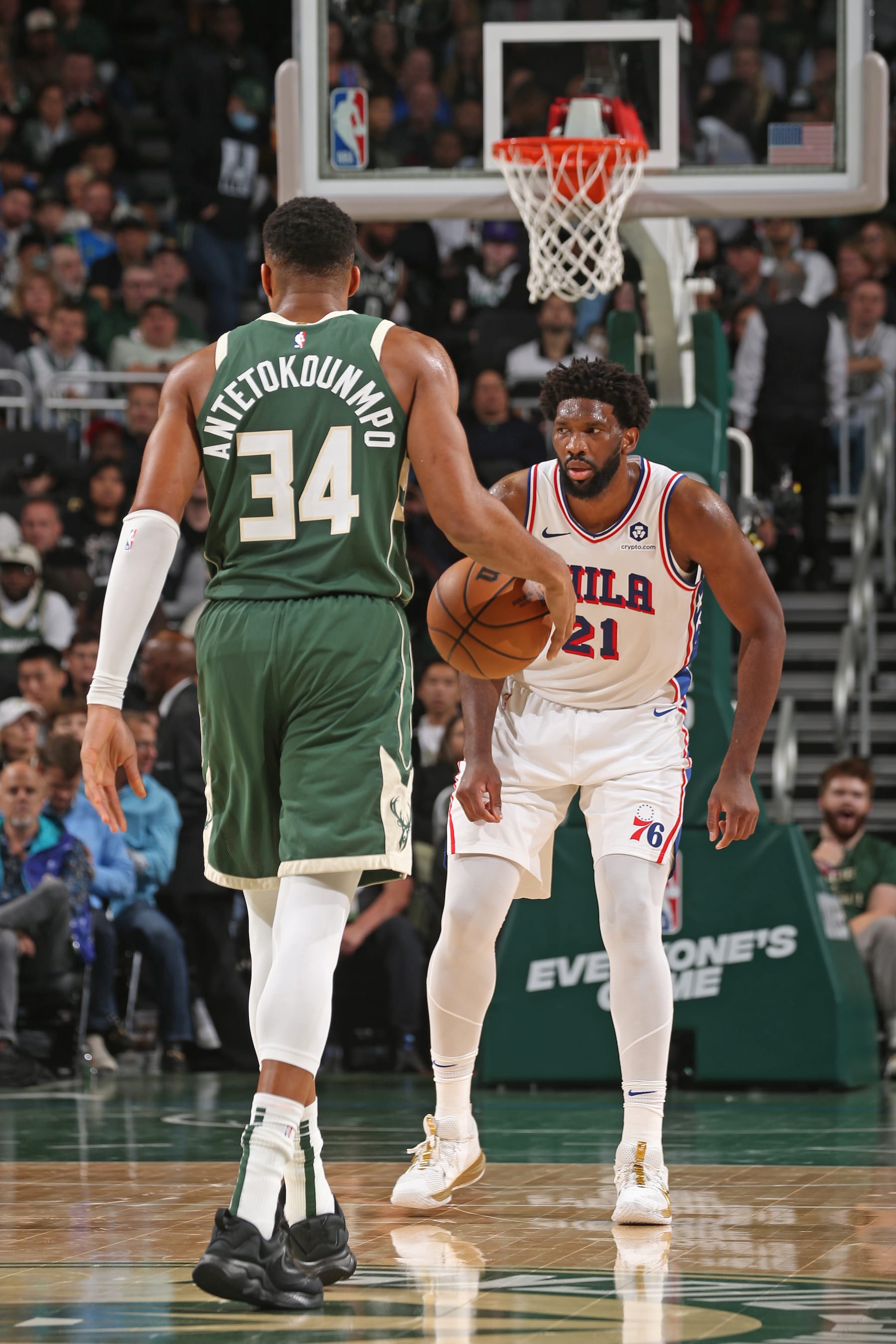 MILWAUKEE, WI - OCTOBER 26:  Giannis Antetokounmpo #34 of the Milwaukee Bucks dribbles the ball as Joel Embiid #21 of the Philadelphia 76ers plays defense on October 26, 2023 at the Fiserv Forum Center in Milwaukee, Wisconsin. NOTE TO USER: User expressly acknowledges and agrees that, by downloading and or using this Photograph, user is consenting to the terms and conditions of the Getty Images License Agreement. Mandatory Copyright Notice: Copyright 2023 NBAE (Photo by Gary Dineen/NBAE via Getty Images).