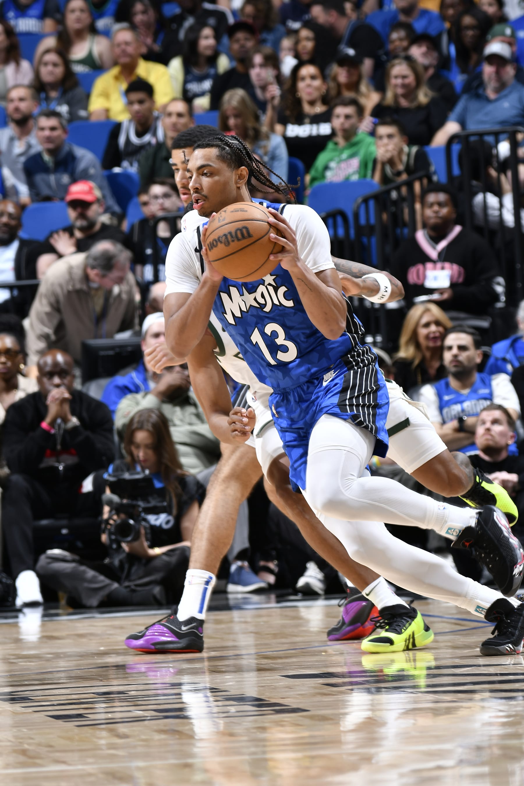 ORLANDO, FL - APRIL 14: Jett Howard #13 of the Orlando Magic handles the ball during the game against the Milwaukee Buck on April 14, 2024 at Kia Center in Orlando, Florida. NOTE TO USER: User expressly acknowledges and agrees that, by downloading and or using this photograph, User is consenting to the terms and conditions of the Getty Images License Agreement. Mandatory Copyright Notice: Copyright 2024 NBAE (Photo by Fernando Medina/NBAE via Getty Images)