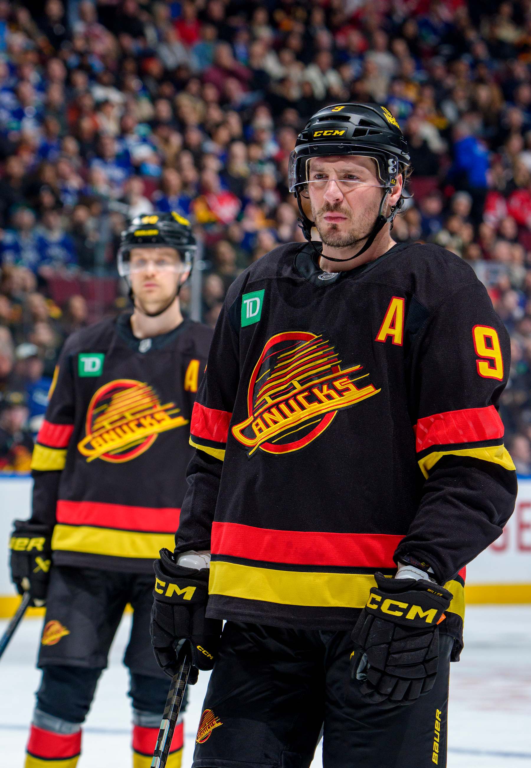 VANCOUVER, CANADA - JANUARY 25: J.T. Miller #9 and Elias Pettersson #40 of the Vancouver Canucks during the first period of their NHL game against the Washington Capitals at Rogers Arena on January 25, 2025 in Vancouver, British Columbia, Canada.  (Photo by Jeff Vinnick/NHLI via Getty Images)