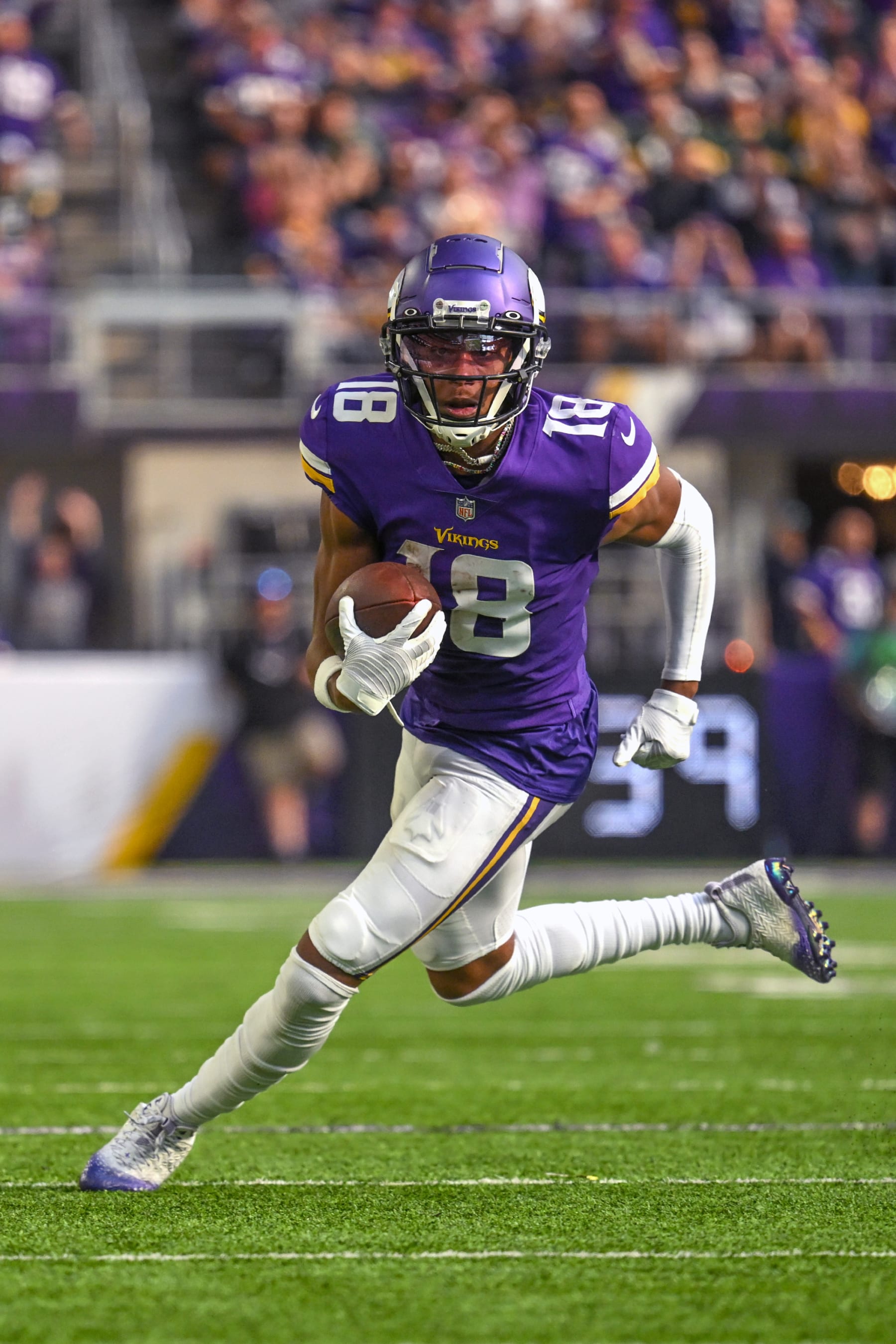 MINNEAPOLIS, MN - SEPTEMBER 11: Minnesota Vikings wide receiver Justin Jefferson (18) runs to the end zone for a 36-yard touchdown reception during the second quarter of an NFL game between the Minnesota Vikings and Green Bay Packers on September 11, 2022 at U.S. Bank Stadium in Minneapolis, MN.(Photo by Nick Wosika/Icon Sportswire via Getty Images)