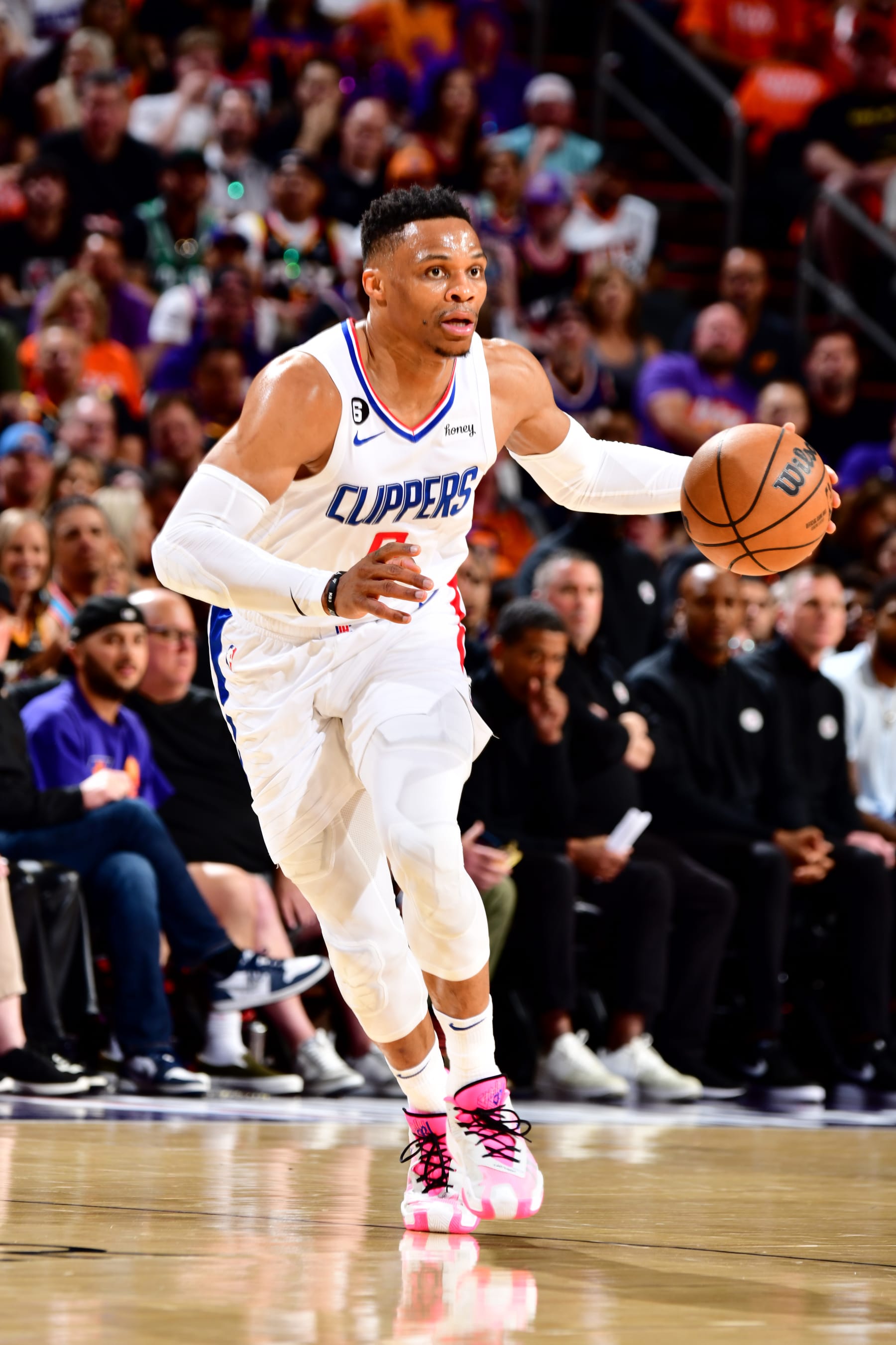 PHOENIX, AZ - APRIL 25: Russell Westbrook  #0 of the LA Clippers dribbles the ball during the game against the Phoenix Suns during Round 1 Game 5 of the 2023 NBA Playoffs on April 25, 2023 at Footprint Center in Phoenix, Arizona. NOTE TO USER: User expressly acknowledges and agrees that, by downloading and or using this photograph, user is consenting to the terms and conditions of the Getty Images License Agreement. Mandatory Copyright Notice: Copyright 2023 NBAE (Photo by Barry Gossage/NBAE via Getty Images)