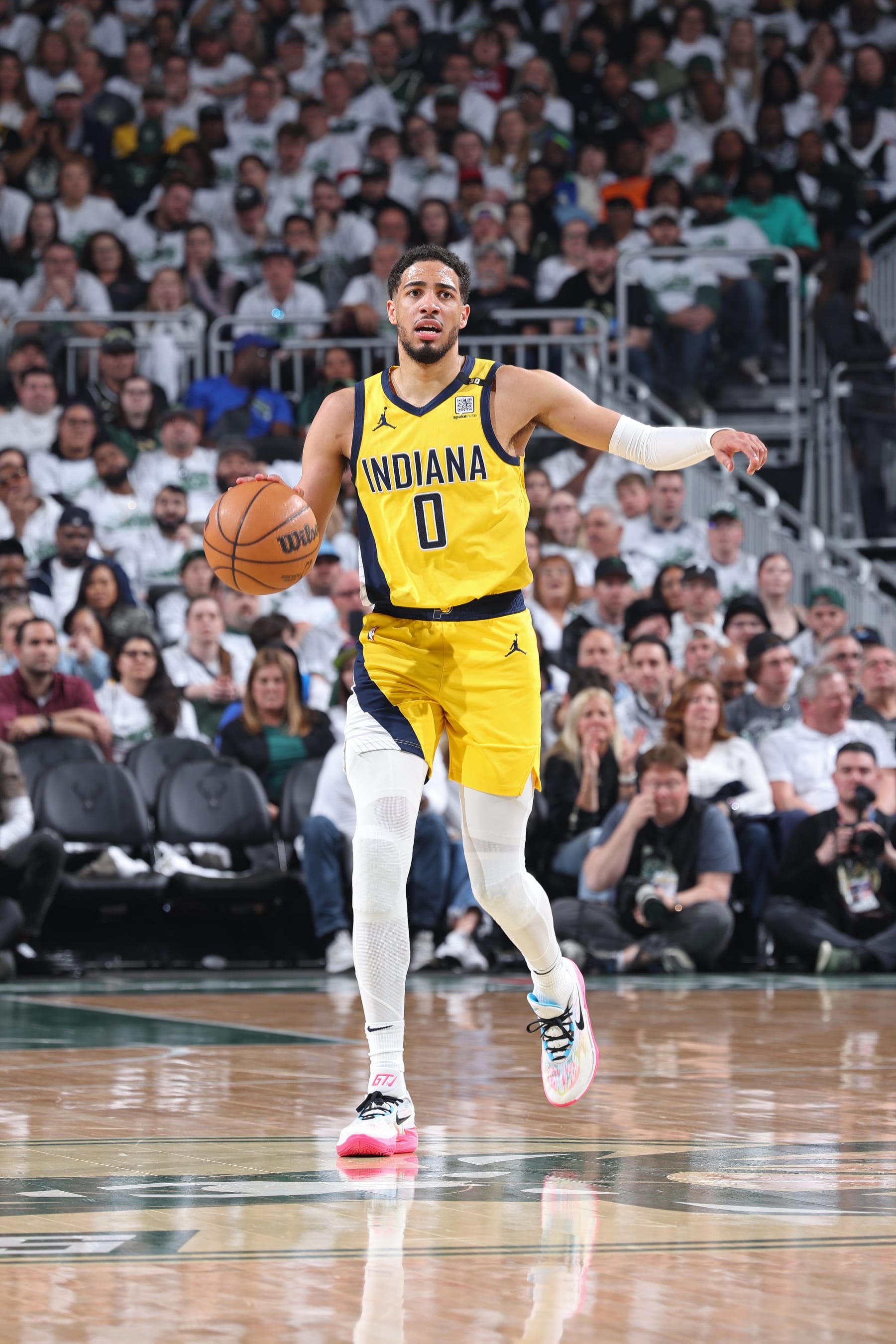 MILWAUKEE, WI - APRIL 23: Tyrese Haliburton #0 of the Indiana Pacers brings the ball up court during Round 1 Game 2 of the 2024 NBA Playoffs against the Milwaukee Bucks on April 23, 2024 at the Fiserv Forum Center in Milwaukee, Wisconsin. NOTE TO USER: User expressly acknowledges and agrees that, by downloading and or using this Photograph, user is consenting to the terms and conditions of the Getty Images License Agreement. Mandatory Copyright Notice: Copyright 2024 NBAE (Photo by Jeff Haynes/NBAE via Getty Images).