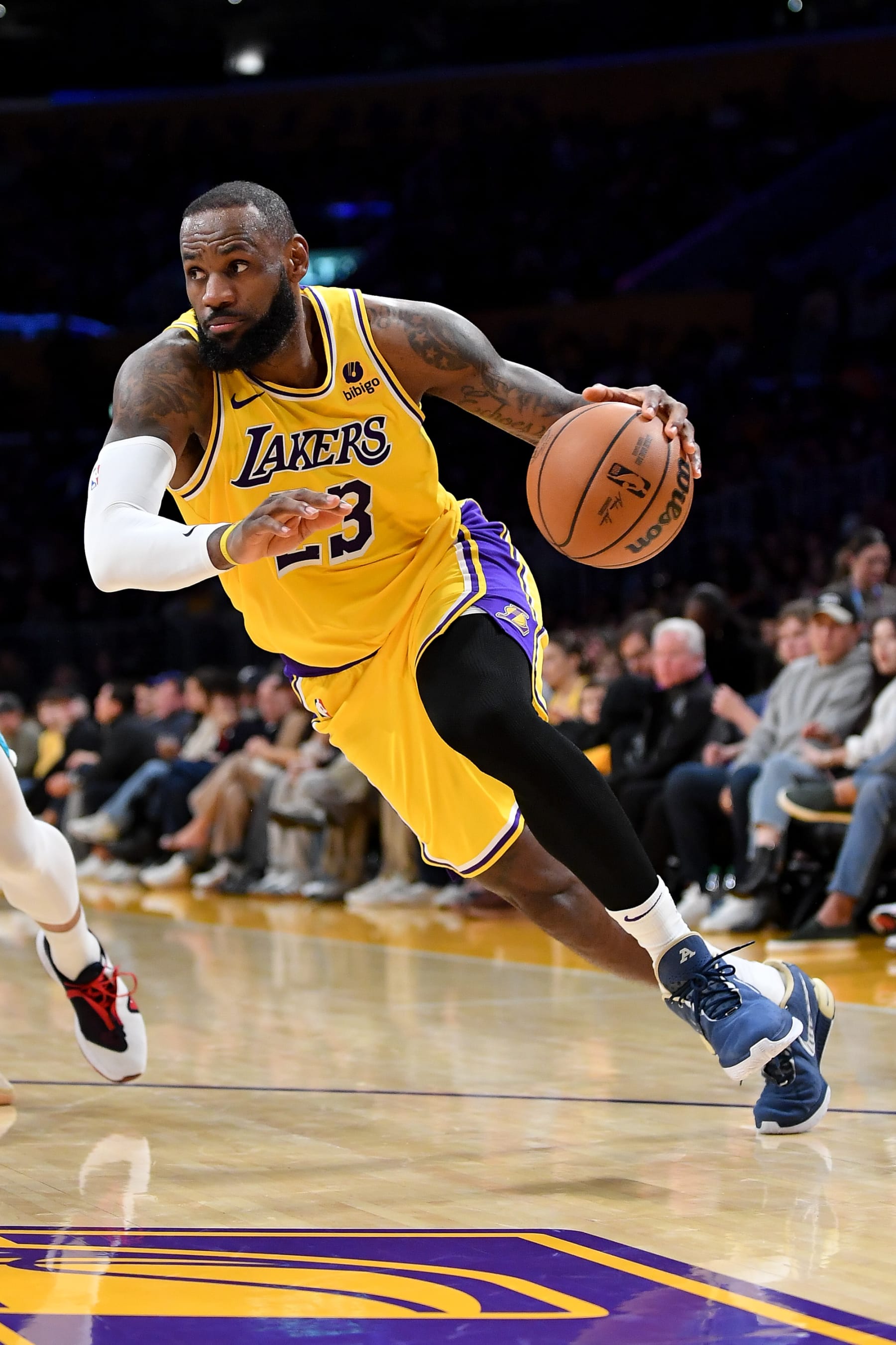 LOS ANGELES, CALIFORNIA - DECEMBER 28: LeBron James #23 of the Los Angeles Lakers dribbles the ball during the third quarter of the game against the Charlotte Hornets at Crypto.com Arena on December 28, 2023 in Los Angeles, California. NOTE TO USER: User expressly acknowledges and agrees that, by downloading and or using this photograph, User is consenting to the terms and conditions of the Getty Images License Agreement. (Photo by Allen Berezovsky/Getty Images)
