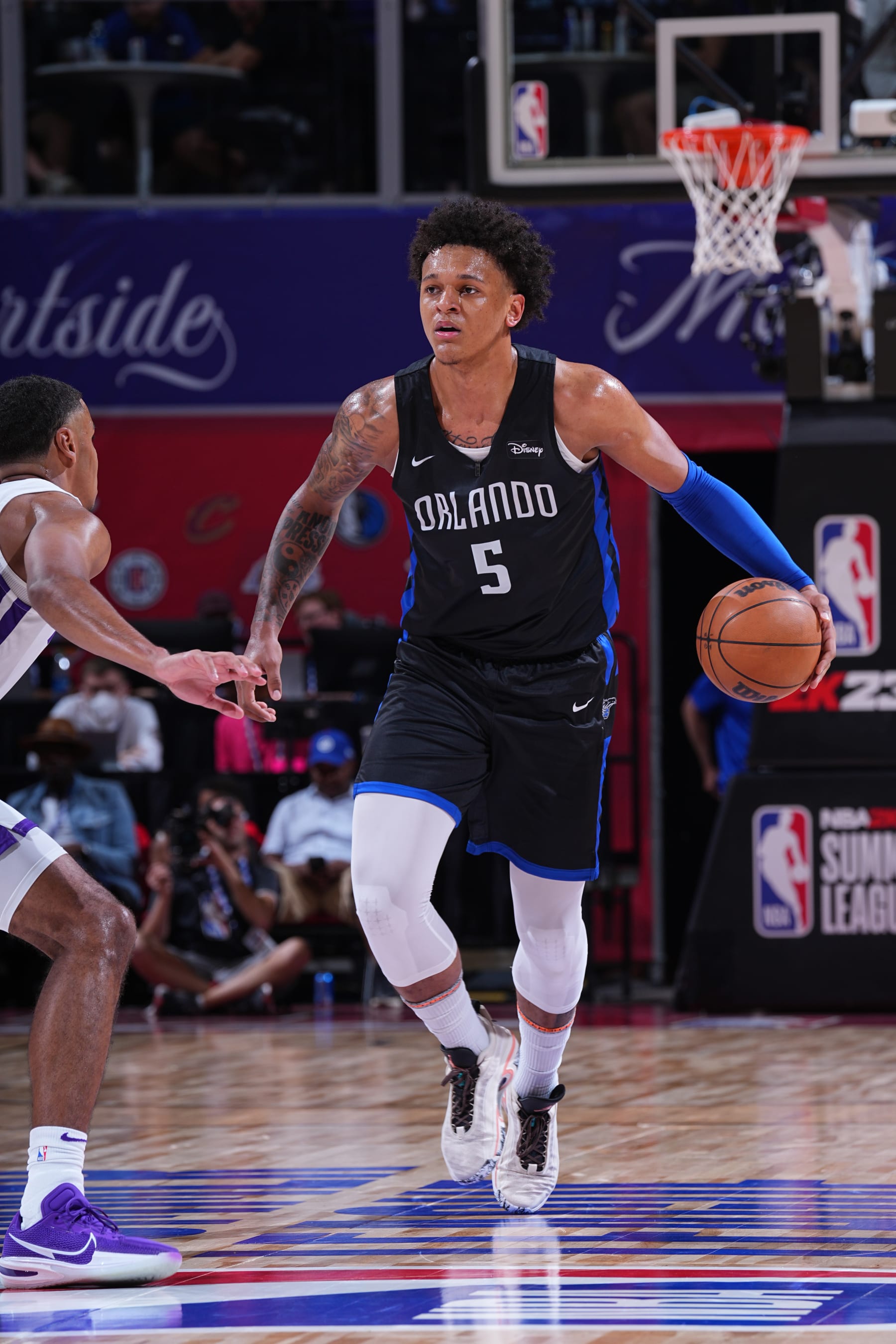 Las Vegas, NV - JULY 9:  Paolo Banchero #5 of the Orlando Magic dribbles the ball against the Sacramento Kings during the 2022 Las Vegas Summer League on July 9, 2022 at the Thomas & Mack Center in Las Vegas, Nevada. NOTE TO USER: User expressly acknowledges and agrees that, by downloading and/or using this Photograph, user is consenting to the terms and conditions of the Getty Images License Agreement. Mandatory Copyright Notice: Copyright 2022 NBAE (Photo by Bart Young/NBAE via Getty Images)