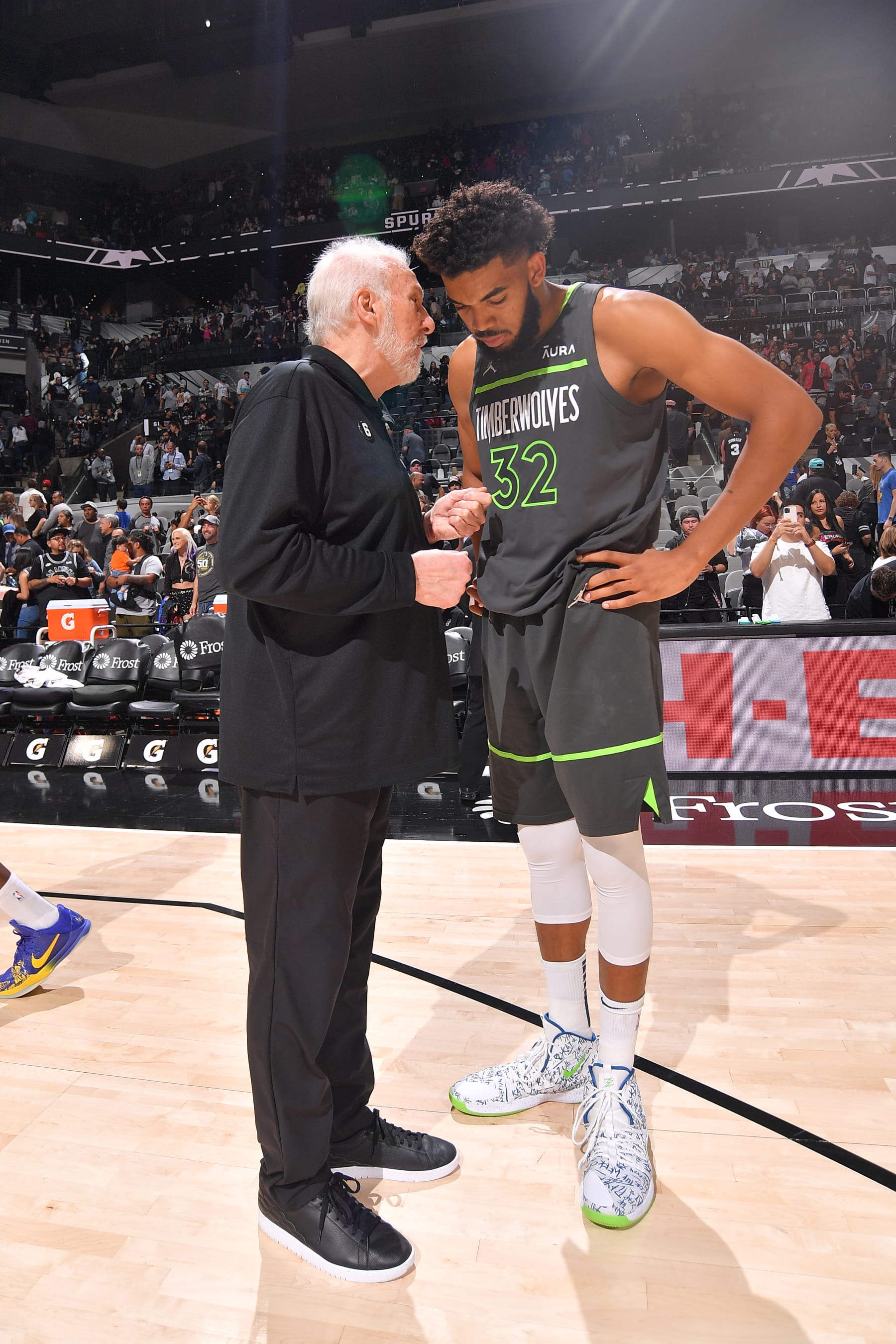 SAN ANTONIO, TX - OCTOBER 30: Head Coach Gregg Popovich of the San Antonio Spurs speaks with Karl-Anthony Towns #32 of the Minnesota Timberwolves after the game on October 30, 2022 at the AT&T Center in San Antonio, Texas. NOTE TO USER: User expressly acknowledges and agrees that, by downloading and or using this photograph, user is consenting to the terms and conditions of the Getty Images License Agreement. Mandatory Copyright Notice: Copyright 2022 NBAE (Photos by Michael Gonzales/NBAE via Getty Images)