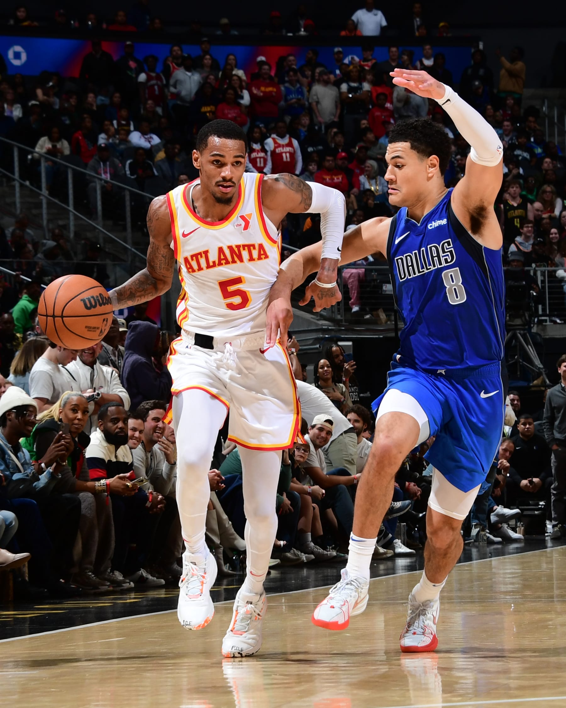 ATLANTA, GA - JANUARY 26: Dejounte Murray #5 of the Atlanta Hawks dribbles the ball during the game against the Dallas Mavericks on January 26, 2024 at State Farm Arena in Atlanta, Georgia.  NOTE TO USER: User expressly acknowledges and agrees that, by downloading and/or using this Photograph, user is consenting to the terms and conditions of the Getty Images License Agreement. Mandatory Copyright Notice: Copyright 2024 NBAE (Photo by Scott Cunningham/NBAE via Getty Images)