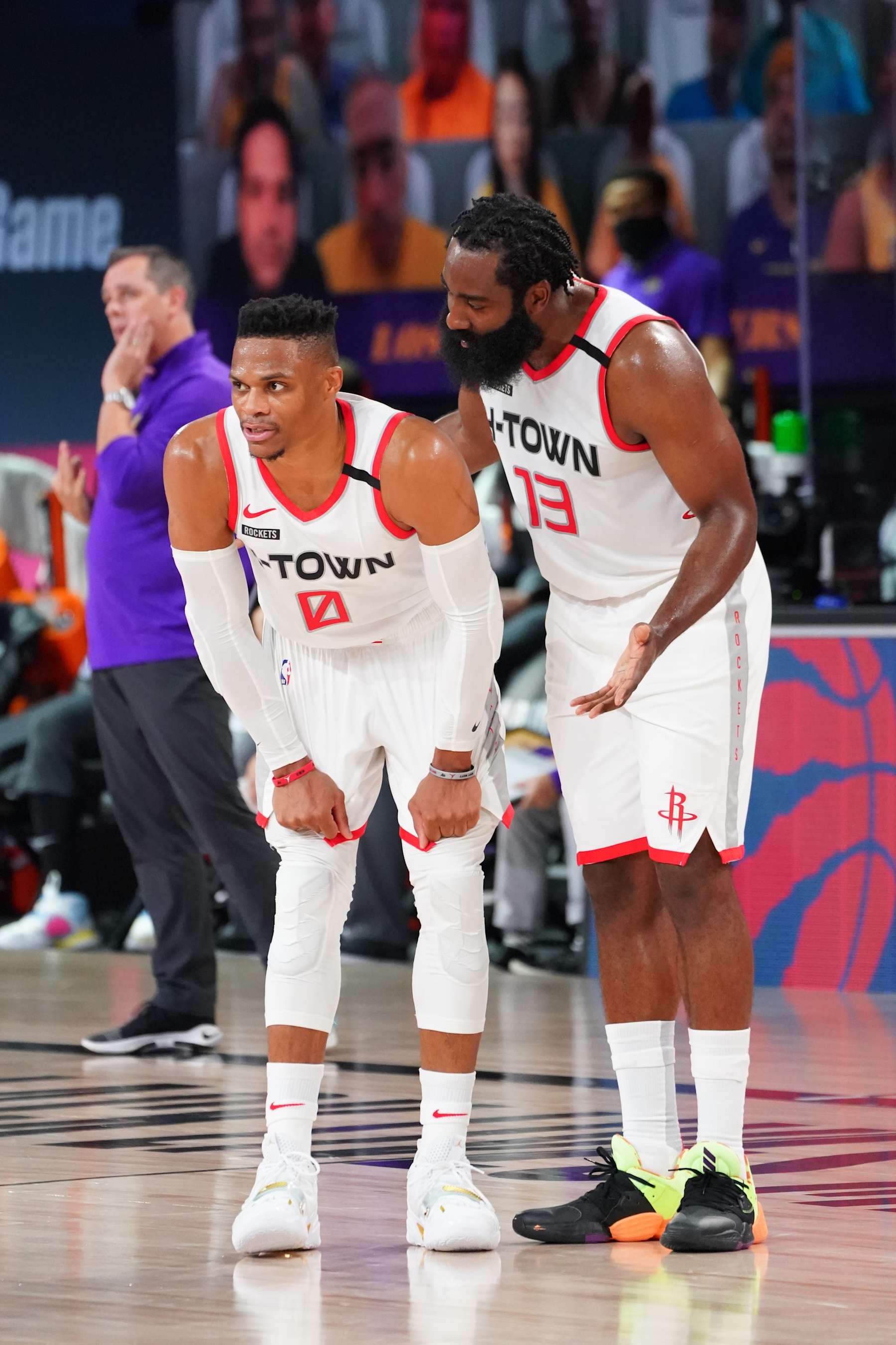 ORLANDO, FL - SEPTEMBER 4: James Harden #13 talks with Russell Westbrook #0 of the Houston Rockets during Game One of the Western Conference SemiFinals of the NBA Playoffs on September 4, 2020 at AdventHealth Arena in Orlando, Florida. NOTE TO USER: User expressly acknowledges and agrees that, by downloading and/or using this Photograph, user is consenting to the terms and conditions of the Getty Images License Agreement. Mandatory Copyright Notice: Copyright 2020 NBAE (Photo by Jesse D. Garrabrant/NBAE via Getty Images)