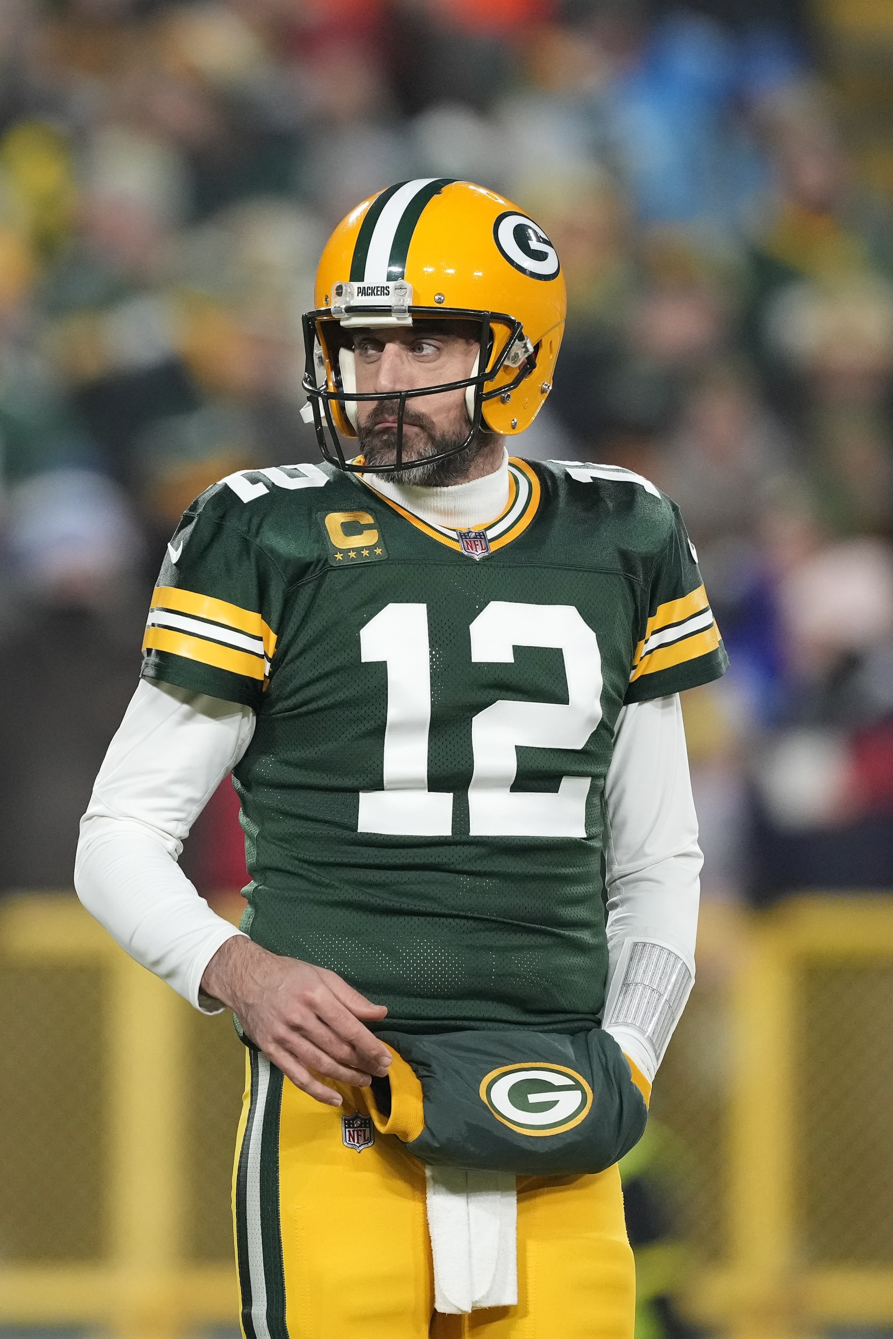 GREEN BAY, WISCONSIN - JANUARY 08: Aaron Rodgers #12 of the Green Bay Packers looks on against the Detroit Lions during the first half at Lambeau Field on January 08, 2023 in Green Bay, Wisconsin. (Photo by Patrick McDermott/Getty Images)