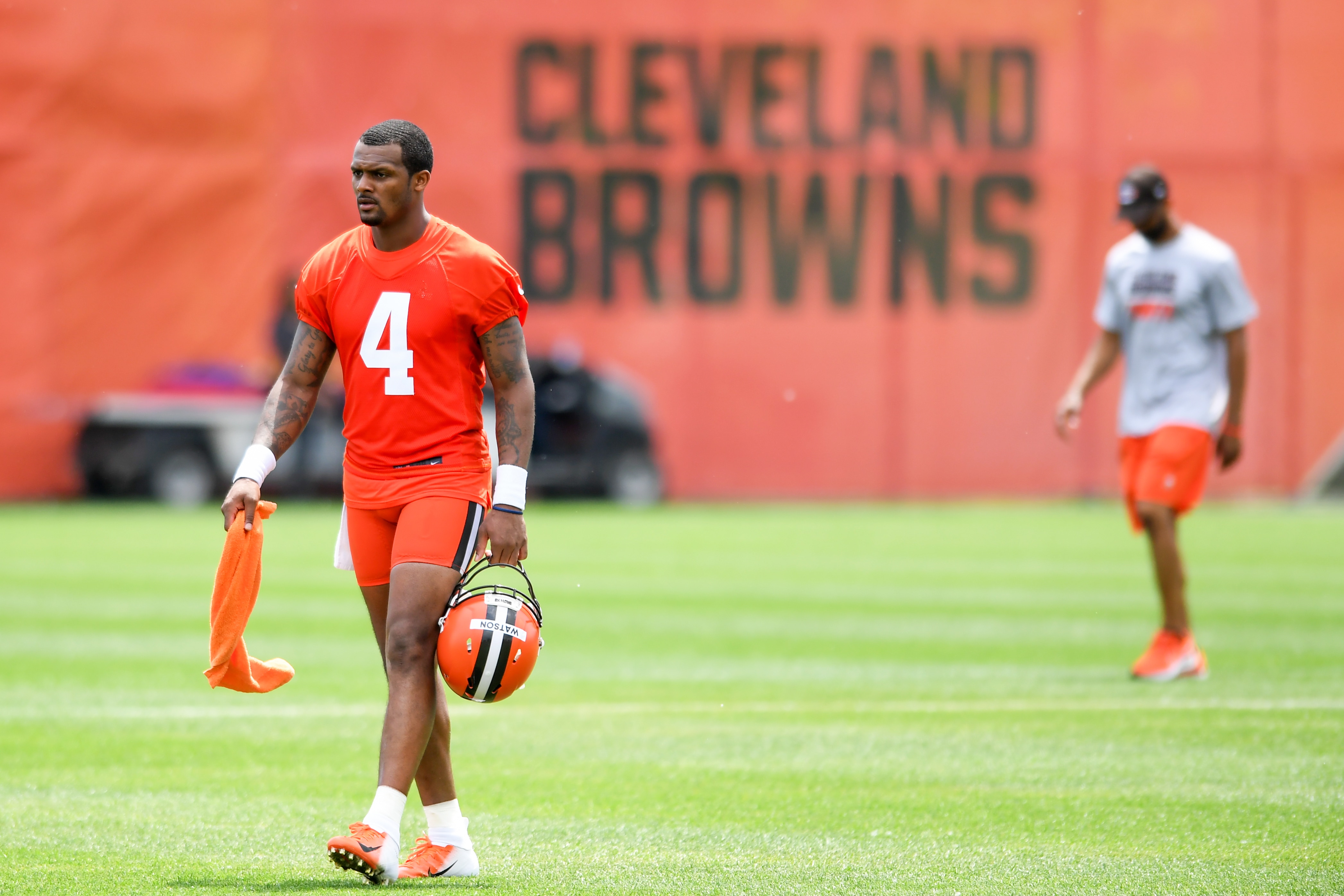 BEREA, OH - JUNE 01: Deshaun Watson #4 of the Cleveland Browns walks off the field as general manager Andrew Berry follows after the Cleveland Browns offseason workout at CrossCountry Mortgage Campus on June 1, 2022 in Berea, Ohio. (Photo by Nick Cammett/Diamond Images via Getty Images)