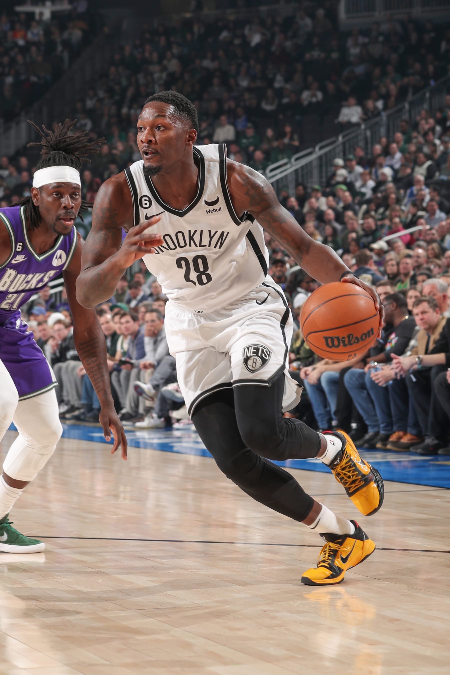 MILWAUKEE, WI - MARCH 9:  Dorian Finney-Smith #28 of the Brooklyn Nets handles the ball during the game  on March 9, 2023 at the Fiserv Forum Center in Milwaukee, Wisconsin. NOTE TO USER: User expressly acknowledges and agrees that, by downloading and or using this Photograph, user is consenting to the terms and conditions of the Getty Images License Agreement. Mandatory Copyright Notice: Copyright 2023 NBAE (Photo by Gary Dineen/NBAE via Getty Images).