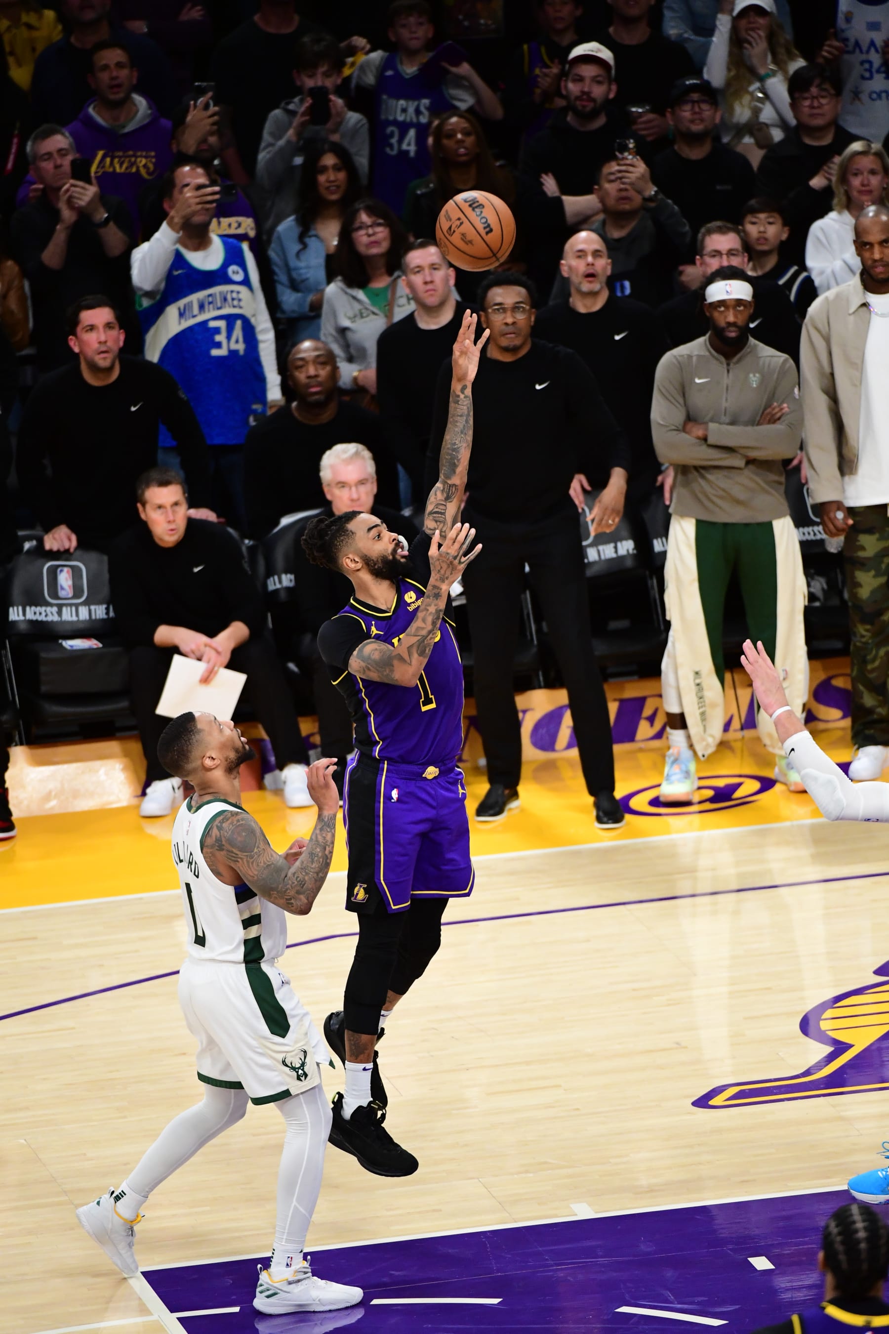 LOS ANGELES, CA - MARCH 8: D'Angelo Russell #1 of the Los Angeles Lakers shoots the game-winning basket during the game against the Milwaukee Bucks on March 8, 2024 at Crypto.Com Arena in Los Angeles, California. NOTE TO USER: User expressly acknowledges and agrees that, by downloading and/or using this Photograph, user is consenting to the terms and conditions of the Getty Images License Agreement. Mandatory Copyright Notice: Copyright 2024 NBAE (Photo by Adam Pantozzi/NBAE via Getty Images)