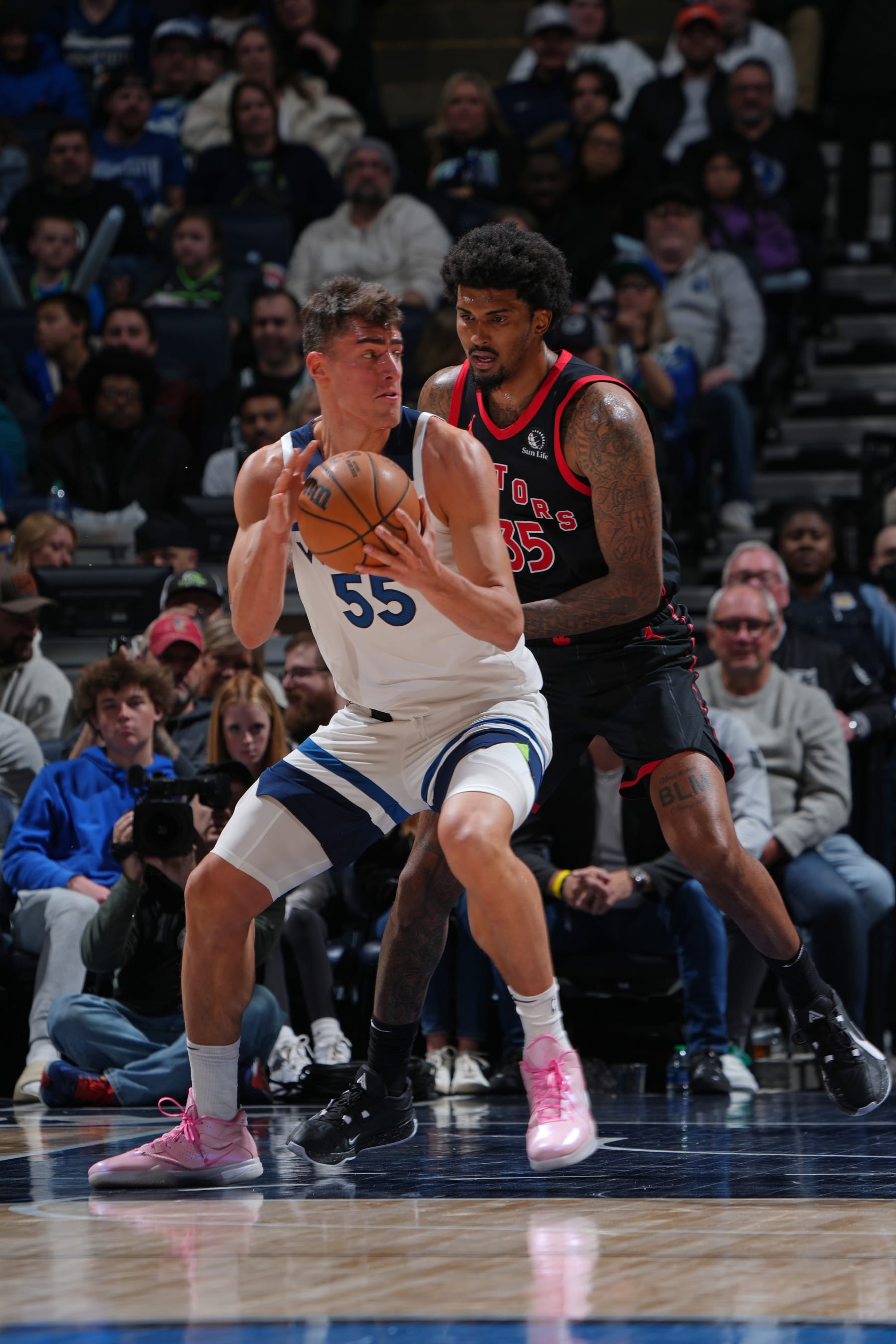 MINNEAPOLIS, MN -  APRIL 3:  Luka Garza #55 of the Minnesota Timberwolves handles the ball during the game against the Toronto Raptors on April 3, 2024 at Target Center in Minneapolis, Minnesota. NOTE TO USER: User expressly acknowledges and agrees that, by downloading and or using this Photograph, user is consenting to the terms and conditions of the Getty Images License Agreement. Mandatory Copyright Notice: Copyright 2024 NBAE (Photo by Jordan Johnson/NBAE via Getty Images)