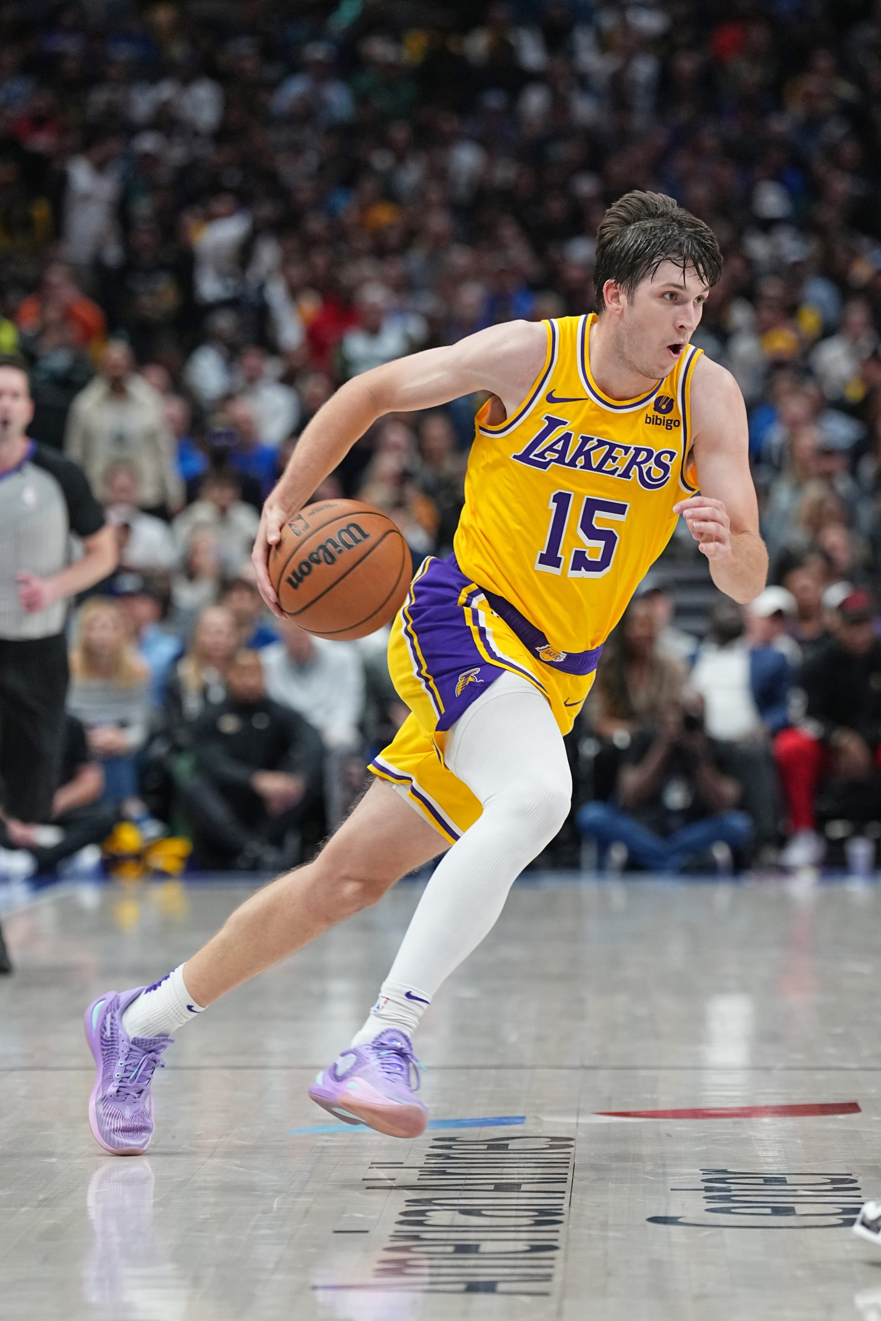 DALLAS, TX - DECEMBER 12: Austin Reaves #15 of the Los Angeles Lakers drives to the basket during the game against the Dallas Mavericks on December 12, 2023 at the American Airlines Center in Dallas, Texas. NOTE TO USER: User expressly acknowledges and agrees that, by downloading and or using this photograph, User is consenting to the terms and conditions of the Getty Images License Agreement. Mandatory Copyright Notice: Copyright 2023 NBAE (Photo by Glenn James/NBAE via Getty Images)