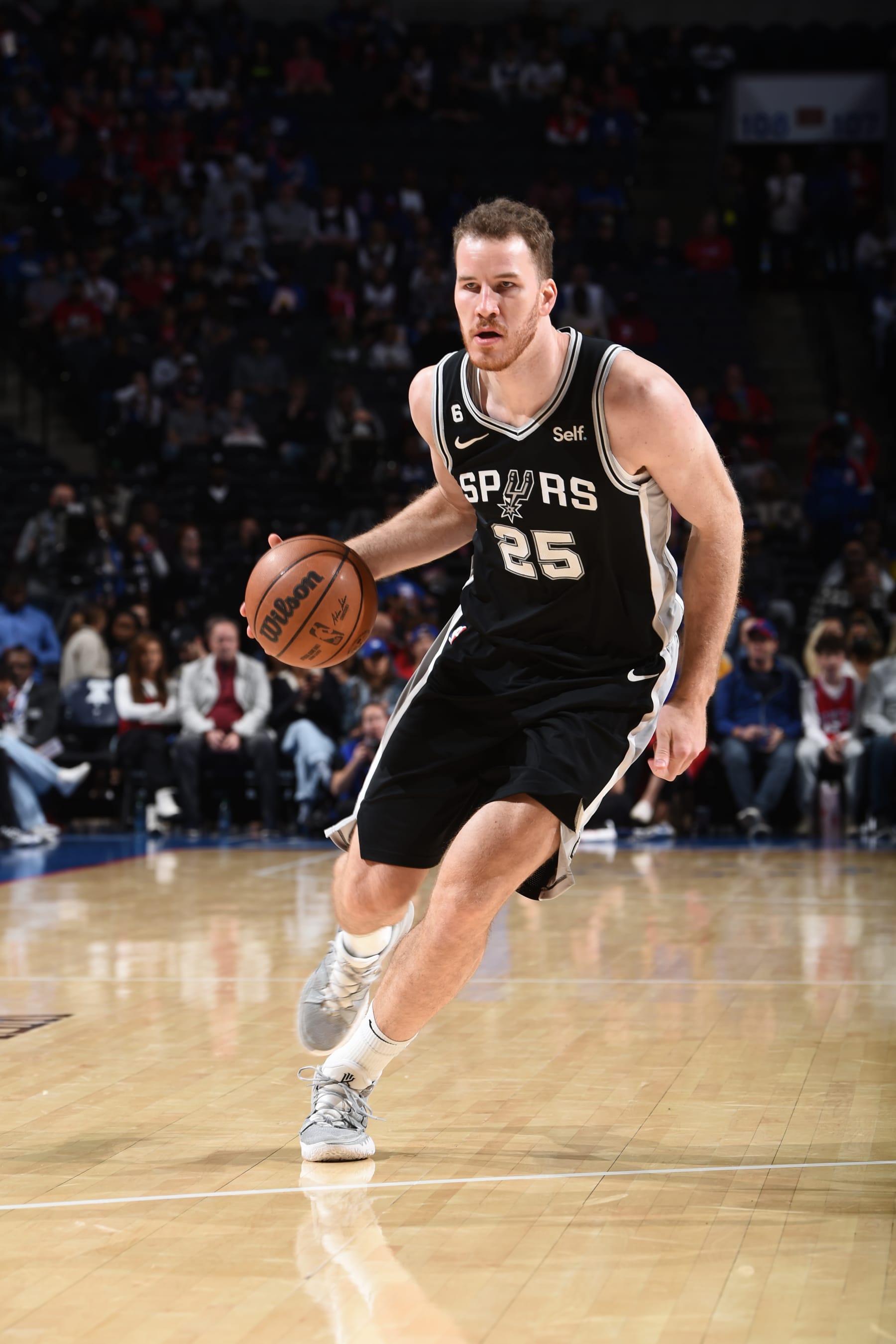PHILADELPHIA, PA - OCTOBER 22: Jakob Poeltl #25 of the San Antonio Spurs dribbles the ball during the game against the Philadelphia 76ers on October 22, 2022 at the Wells Fargo Center in Philadelphia, Pennsylvania NOTE TO USER: User expressly acknowledges and agrees that, by downloading and/or using this Photograph, user is consenting to the terms and conditions of the Getty Images License Agreement. Mandatory Copyright Notice: Copyright 2022 NBAE (Photo by David Dow/NBAE via Getty Images)