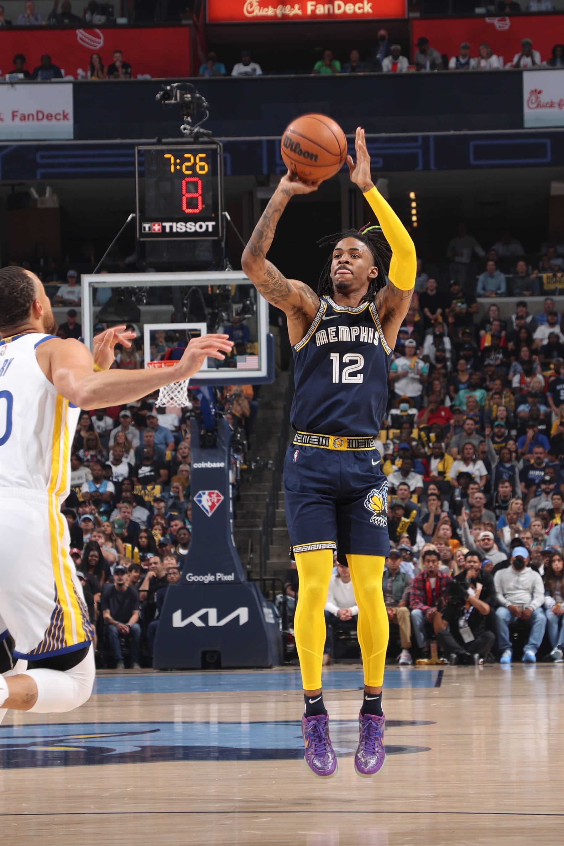 MEMPHIS, TN - MAY 3: Ja Morant #12 of the Memphis Grizzlies shoots a three point basket against the Golden State Warriors during Game 2 of the 2022 NBA Playoffs Western Conference Semifinals on May 3, 2022 at FedExForum in Memphis, Tennessee. NOTE TO USER: User expressly acknowledges and agrees that, by downloading and or using this photograph, User is consenting to the terms and conditions of the Getty Images License Agreement. Mandatory Copyright Notice: Copyright 2022 NBAE (Photo by Joe Murphy/NBAE via Getty Images)