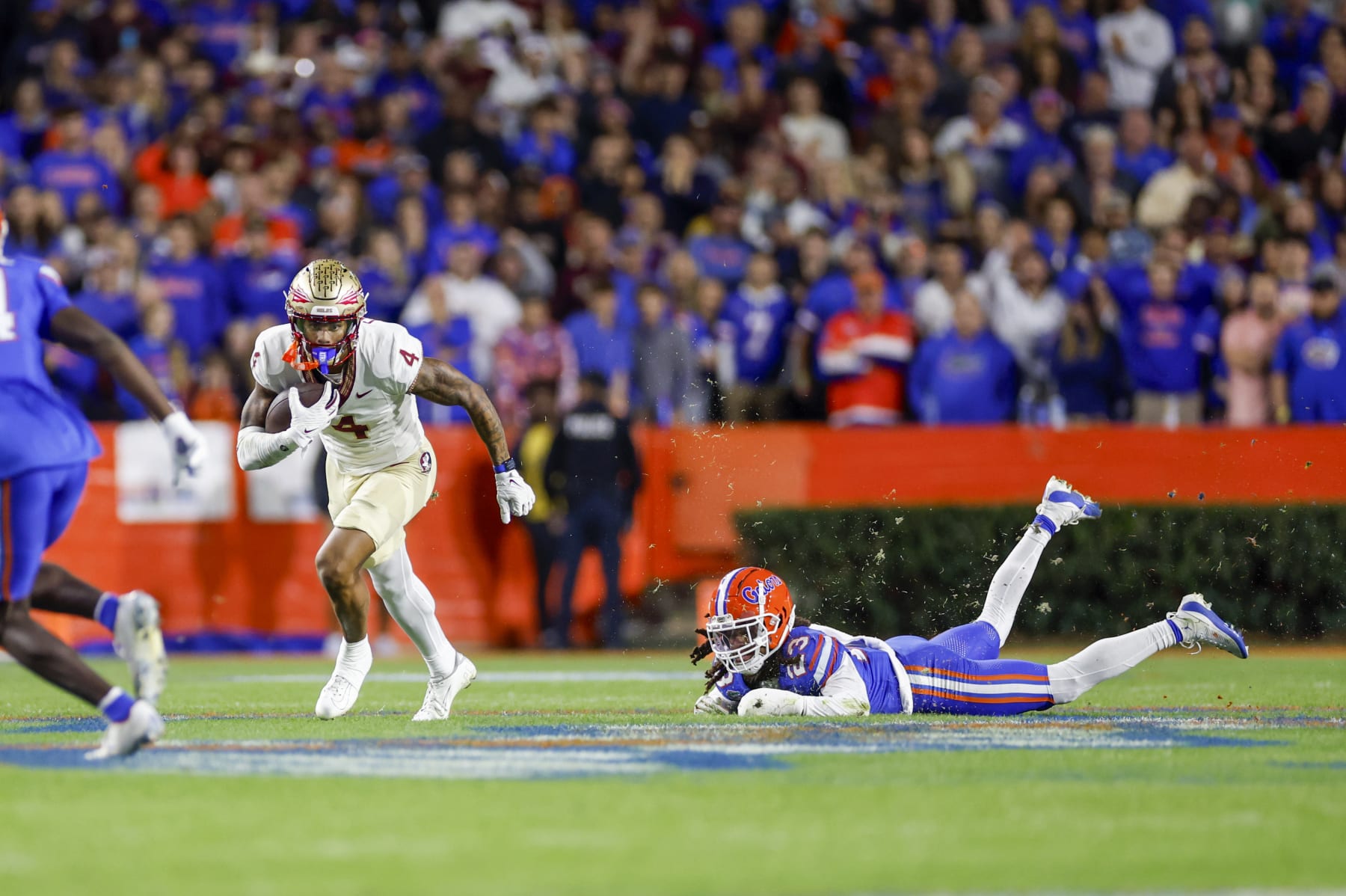GAINESVILLE, FL - NOVEMBER 25: Florida State Seminoles wide receiver Keon Coleman (4) runs with the ball during the game between the Florida Gators and the Florida State Seminoles on November 25, 2023 at Ben Hill Griffin Stadium at Florida Field in Gainesville, Fl. (Photo by David Rosenblum/Icon Sportswire via Getty Images)