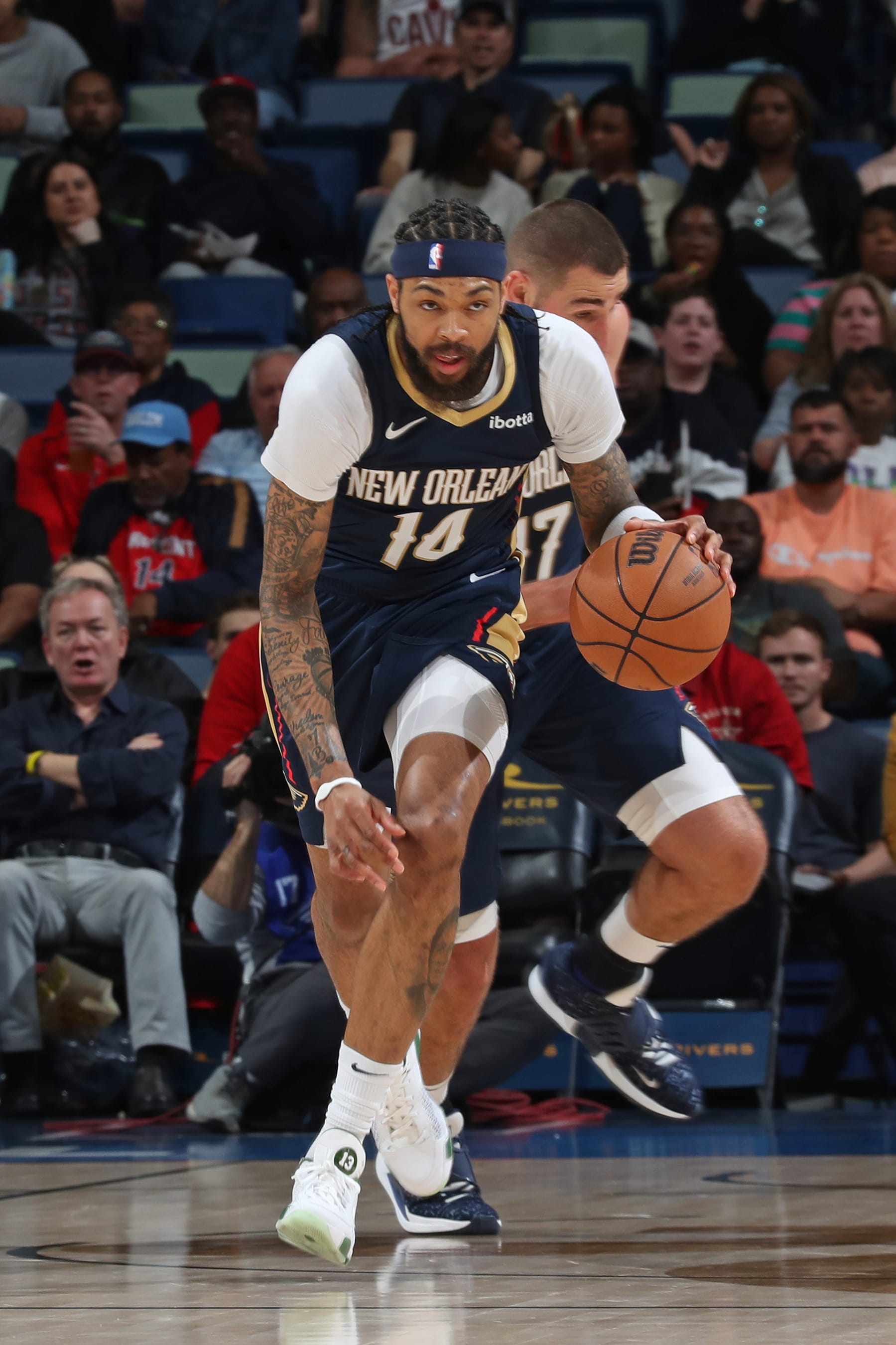 NEW ORLEANS, LA - MARCH 13: Brandon Ingram #14 of the New Orleans Pelicans brings the ball up court during the game against the Cleveland Cavaliers on March 13, 2024 at the Smoothie King Center in New Orleans, Louisiana. NOTE TO USER: User expressly acknowledges and agrees that, by downloading and or using this Photograph, user is consenting to the terms and conditions of the Getty Images License Agreement. Mandatory Copyright Notice: Copyright 2024 NBAE (Photo by Layne Murdoch Jr./NBAE via Getty Images)